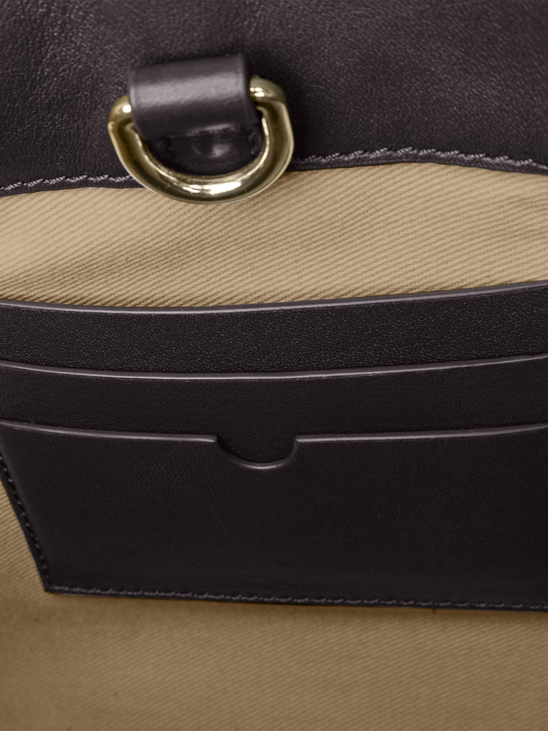 Closeup of credit card slots inside bag. Color shown is Madrid.