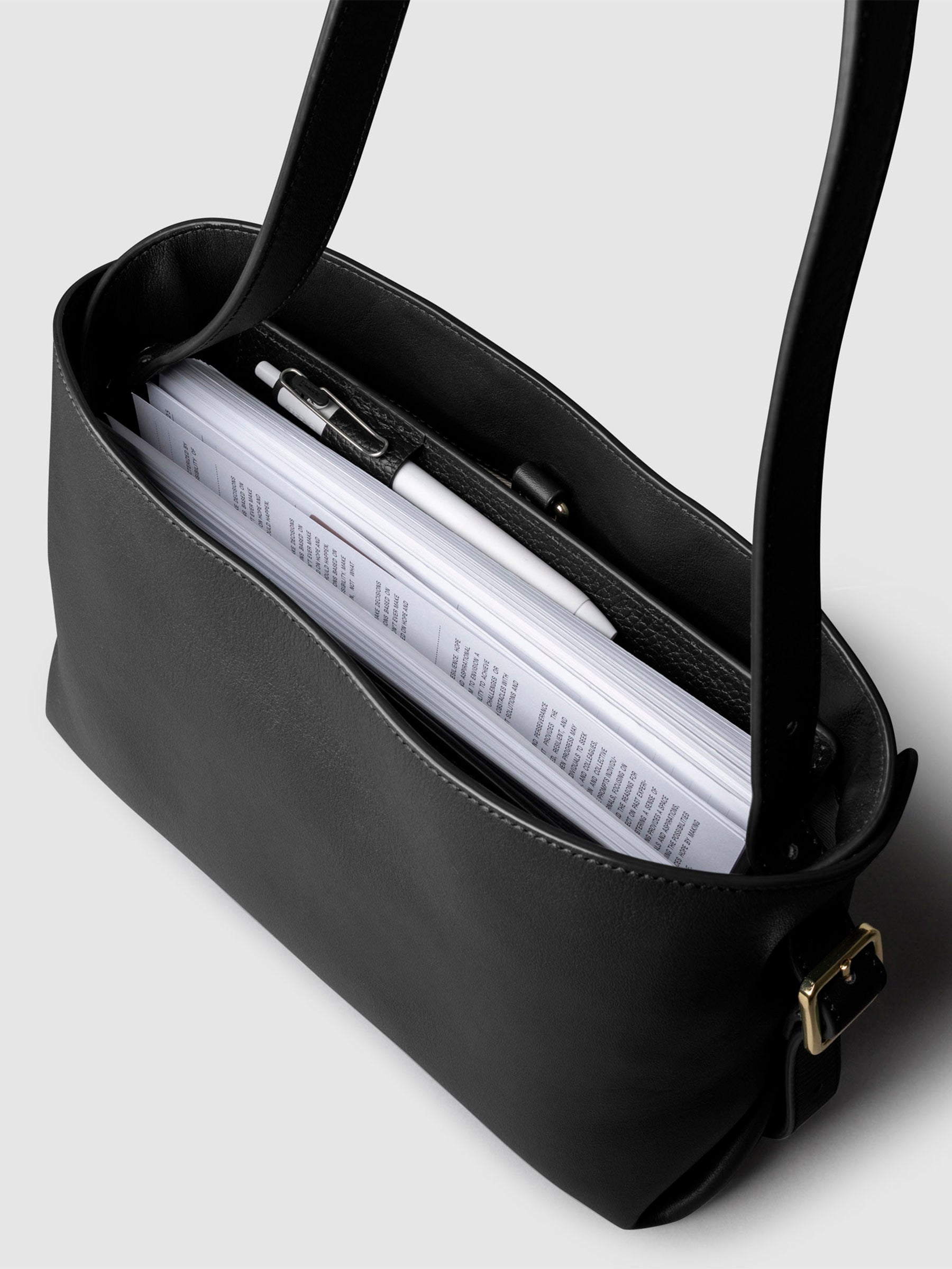 Bag shown from above with a planner inside of it. Color shown is Padrillo.