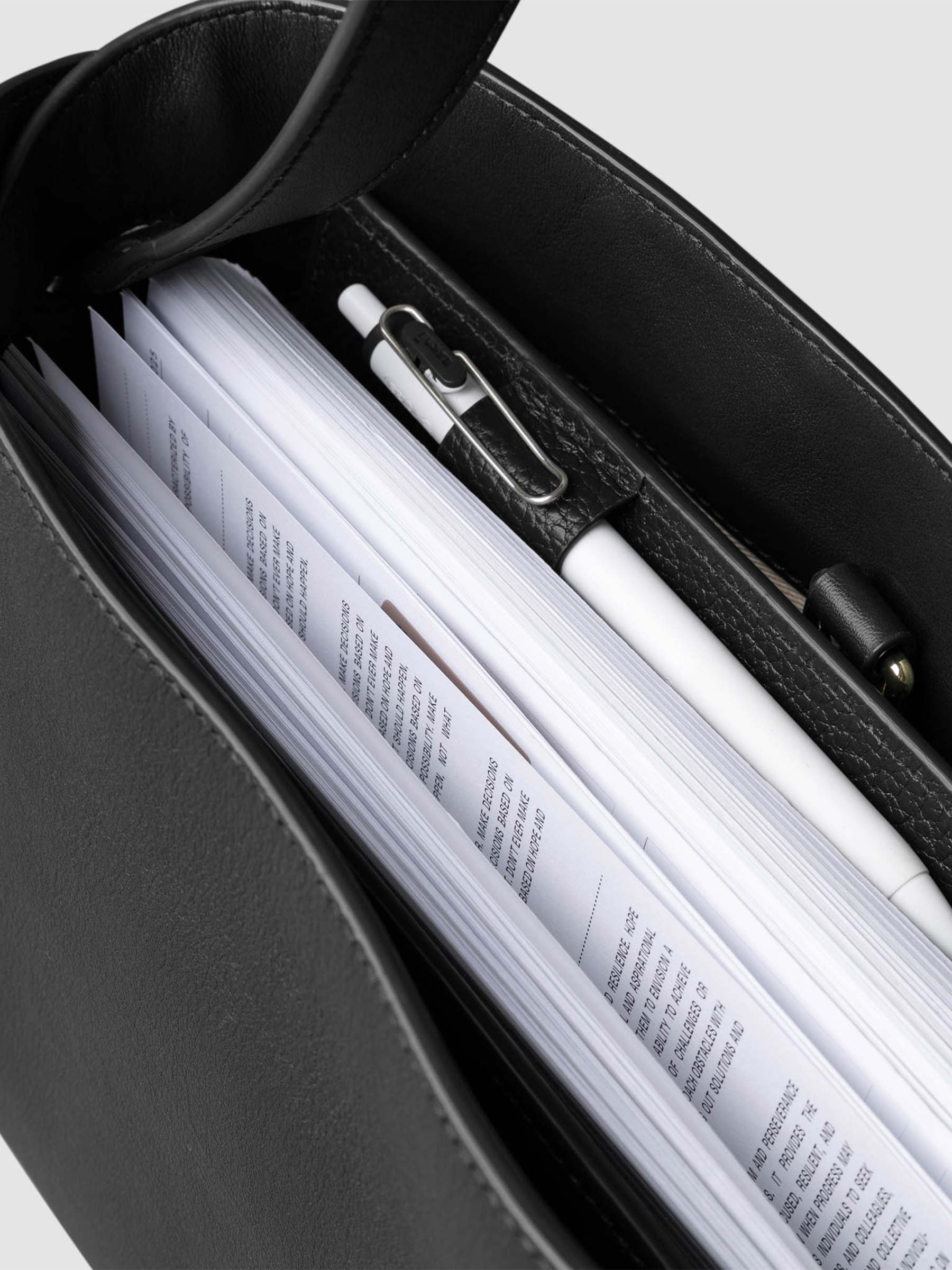 Bag shown from above with a planner inside of it. Color shown is Padrillo.