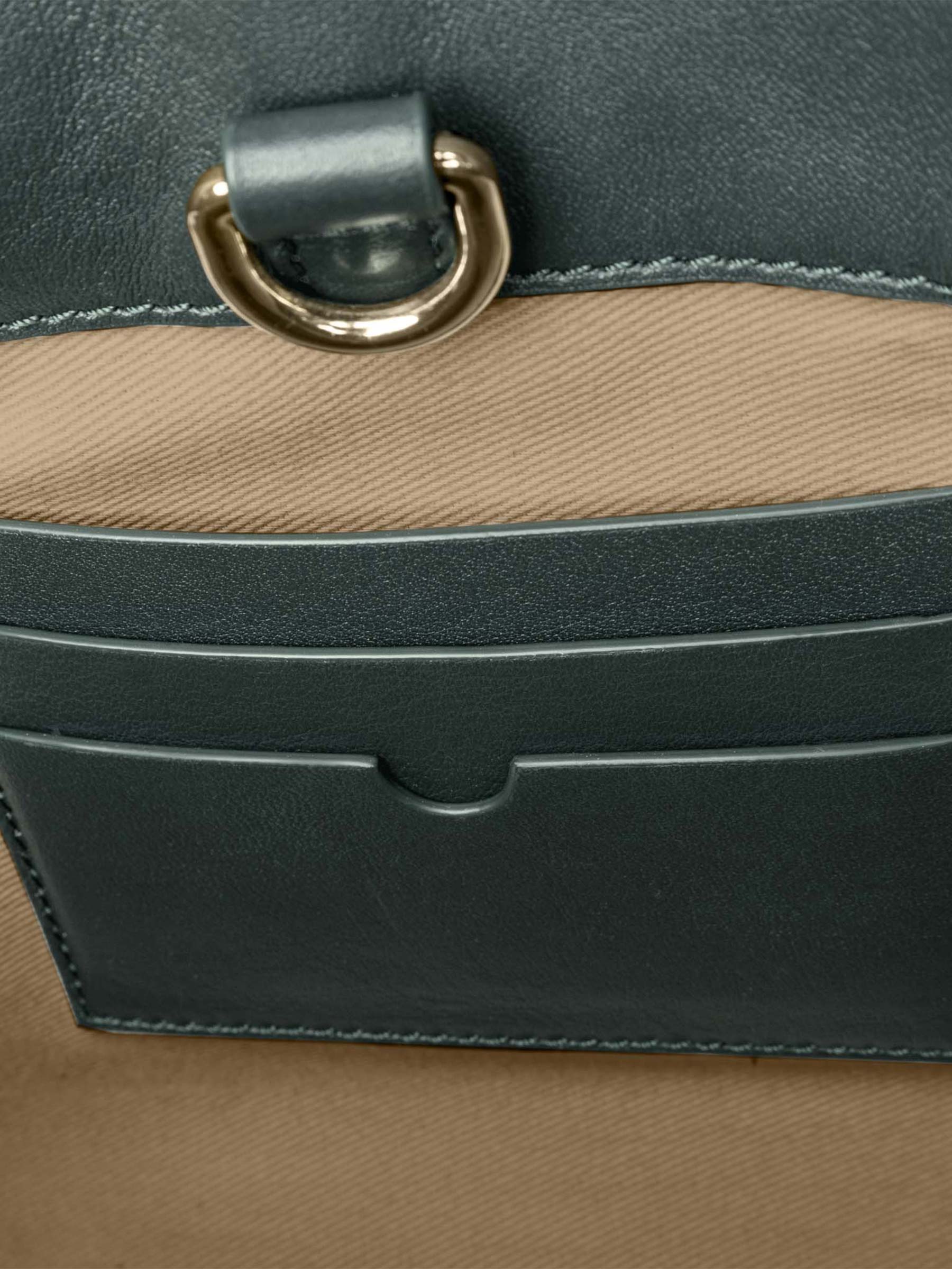 Closeup of credit card slots inside bag. Color shown is Salamanca.