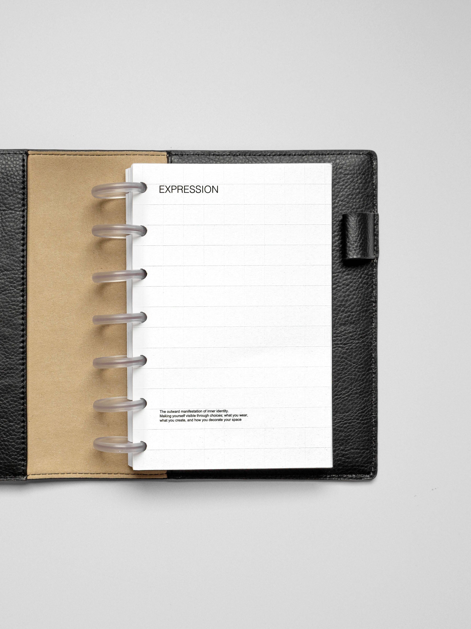 HP Mini Tile Planner Dashboard shown in a compact black and tan planner, featuring a grid layout and the word "EXPRESSION" at the top.
