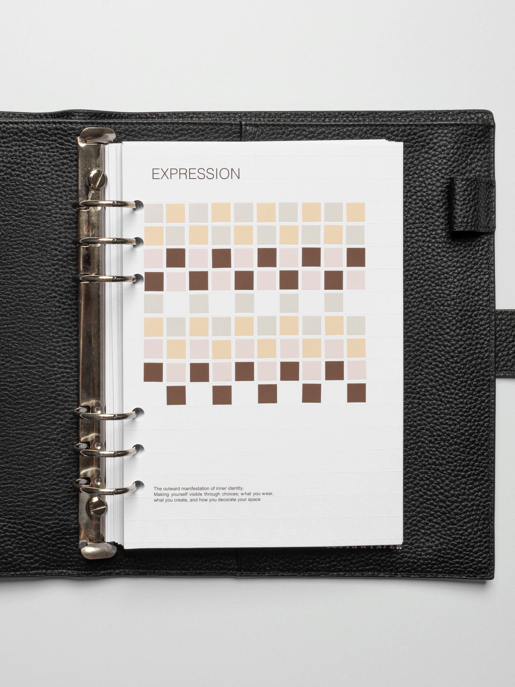 A5 ring-bound planner open to the Tile Planner Dashboard, fully decorated with Square Stickers in neutral tones.