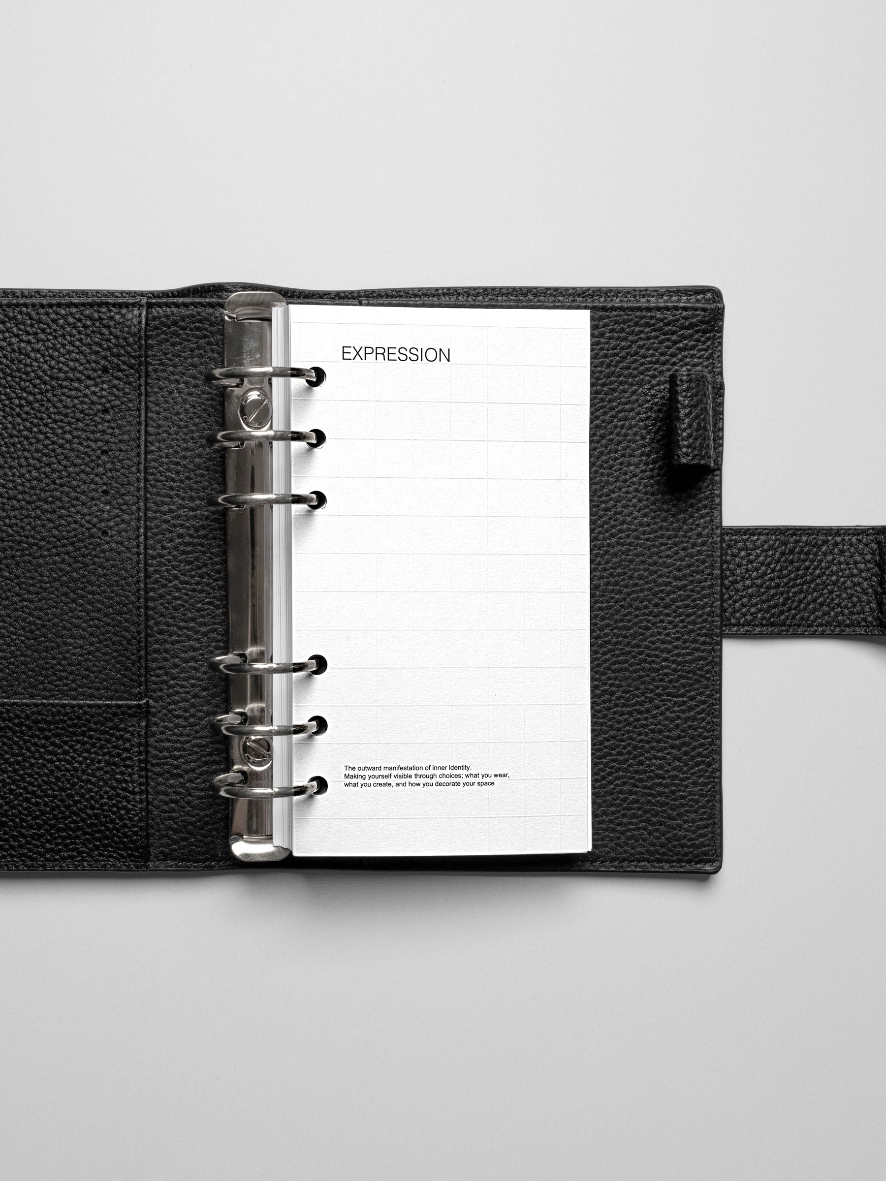 Personal size planner open to the Tile Planner Dashboard, providing a blank grid space for adding Square Stickers or notes.