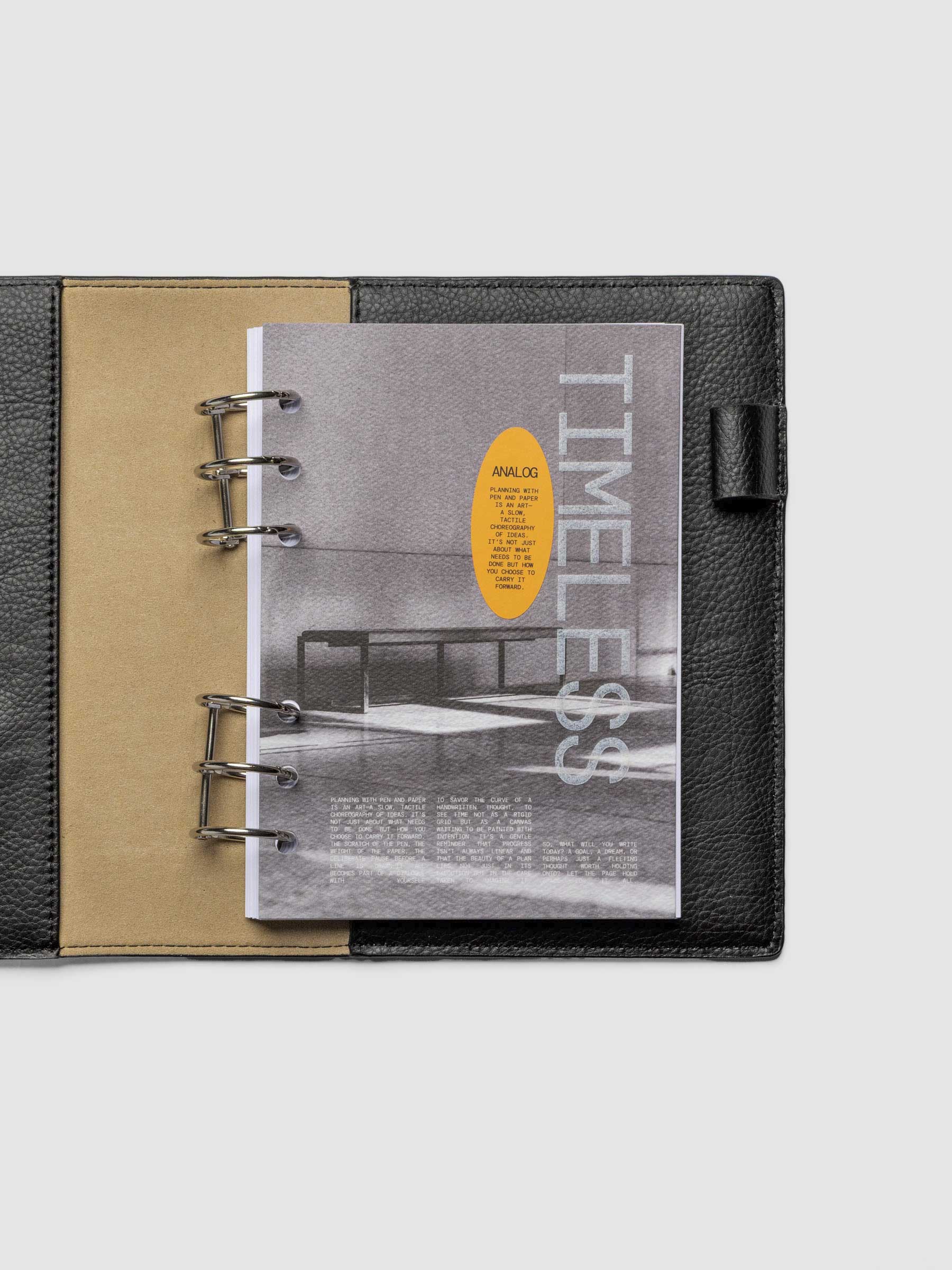 Personal Wide dashboard displayed in a leather agenda on a neutral background.