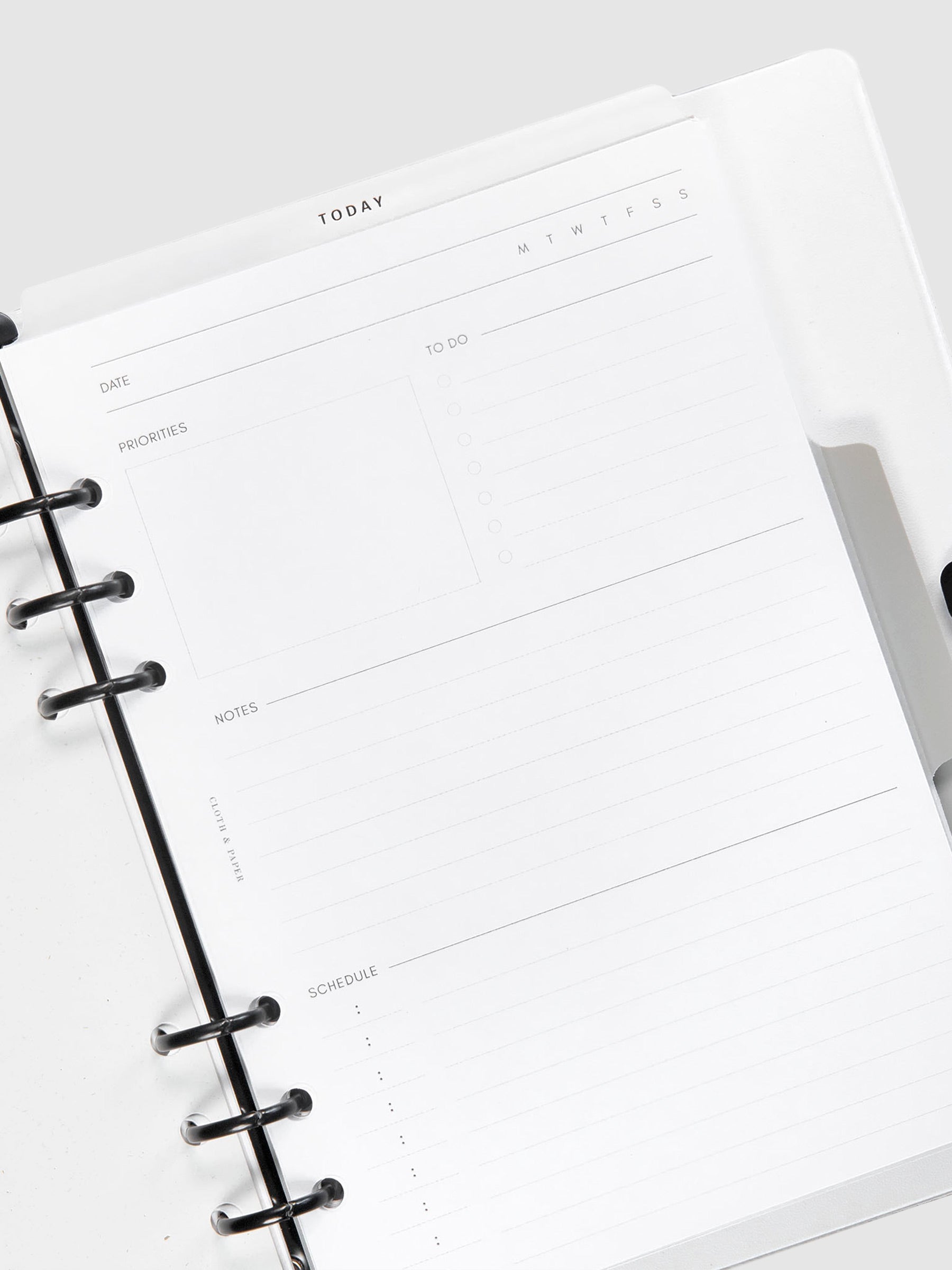 Today Dry Erase Tab Divider, Black Text, Cloth and Paper. Tab divider in use inside of a white leather 6-ring planner agenda.