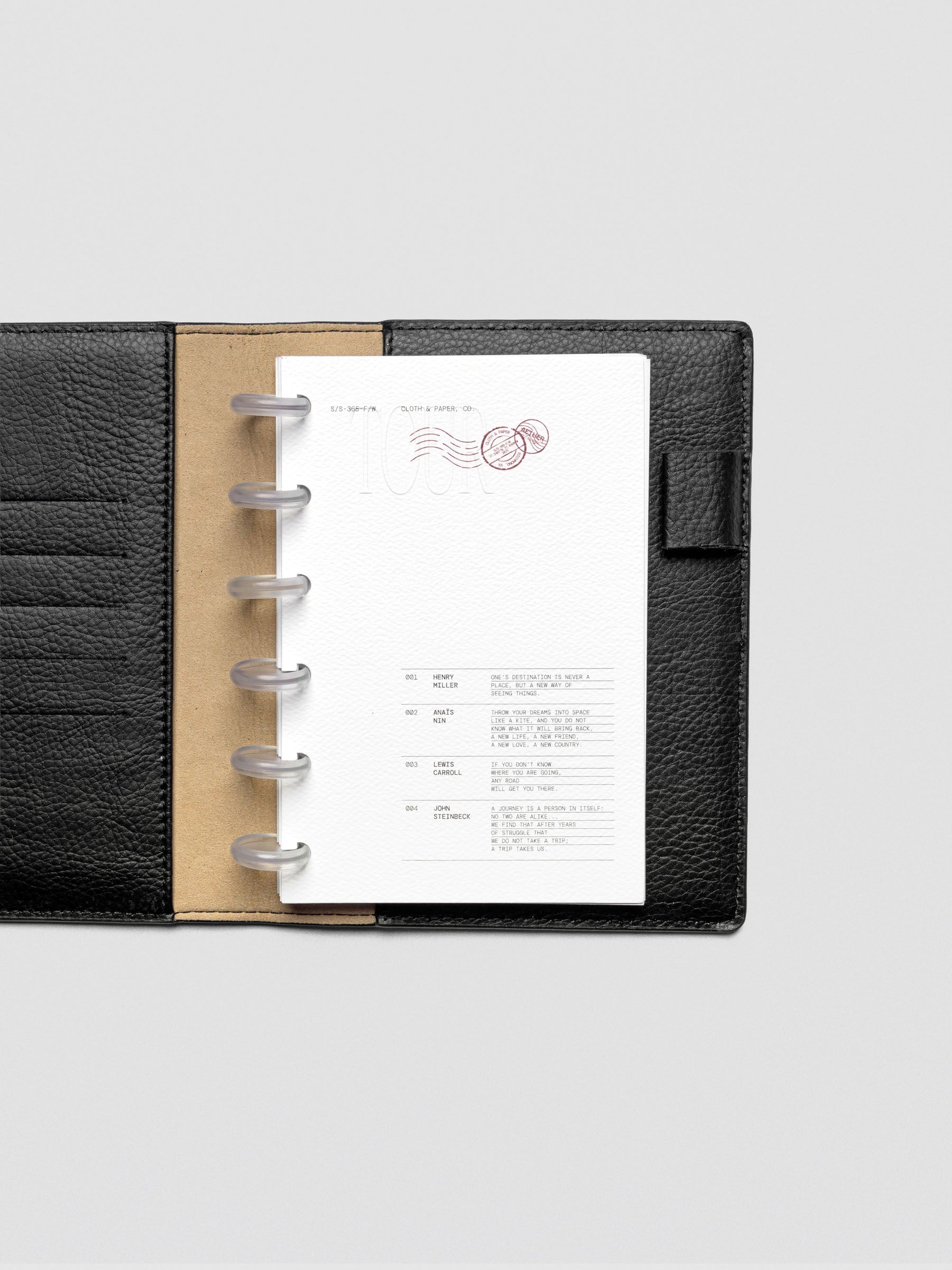 Tour Dashboard CP Petite with TOUR embossed in Bordeaux and quotes in black print.