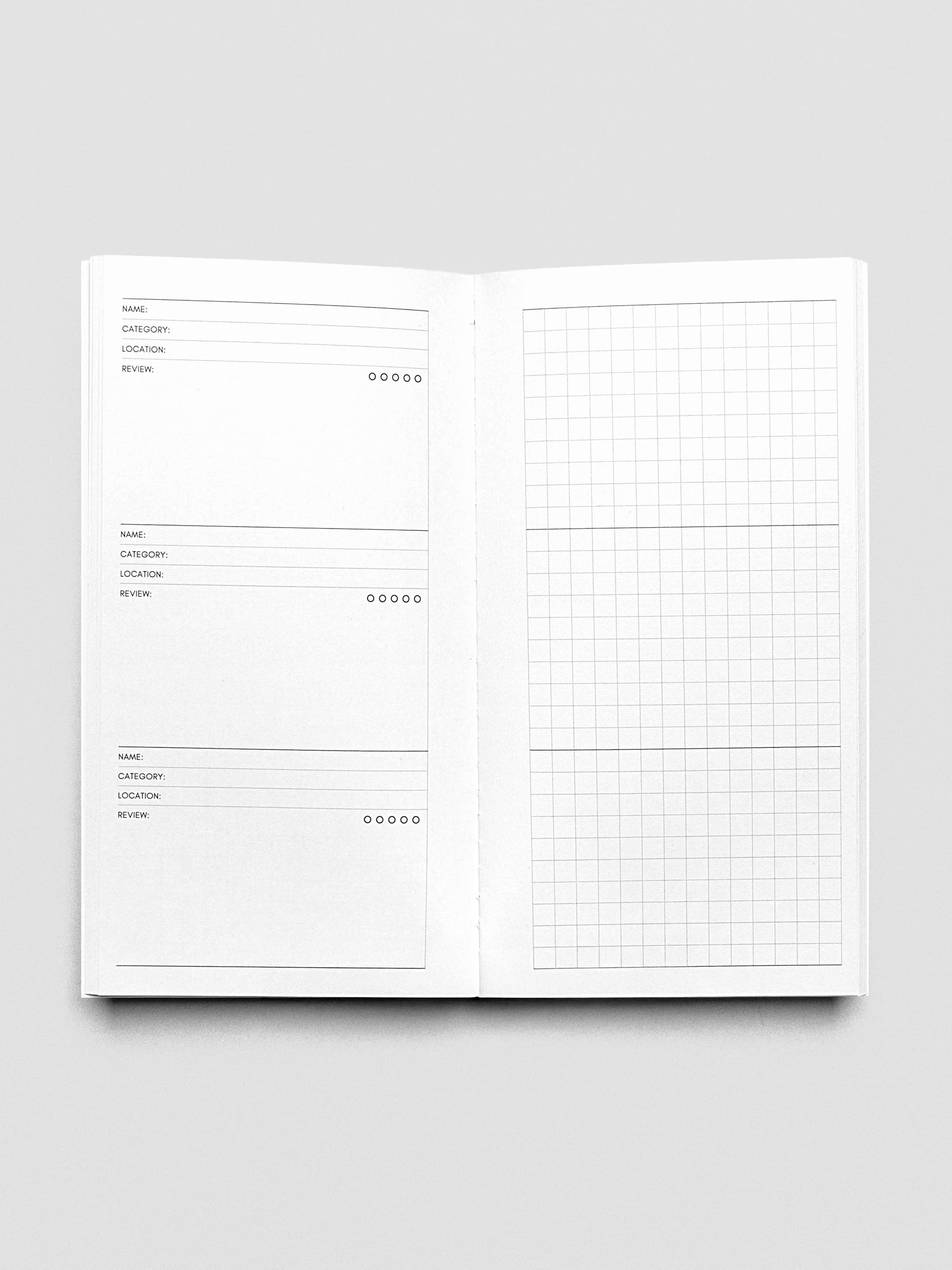 Pocket Plus Travel Notebook shown open displaying the Experience Tracker pages.