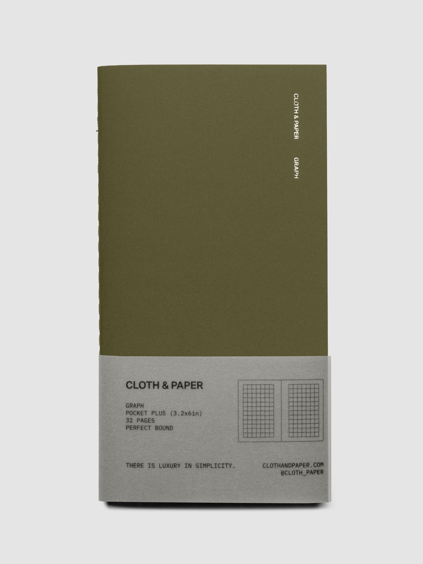 Travel Notebook | Pocket Plus with Graph Note page layouts in Olive green, showing the minimalist cover with foil branding and belly band packaging.