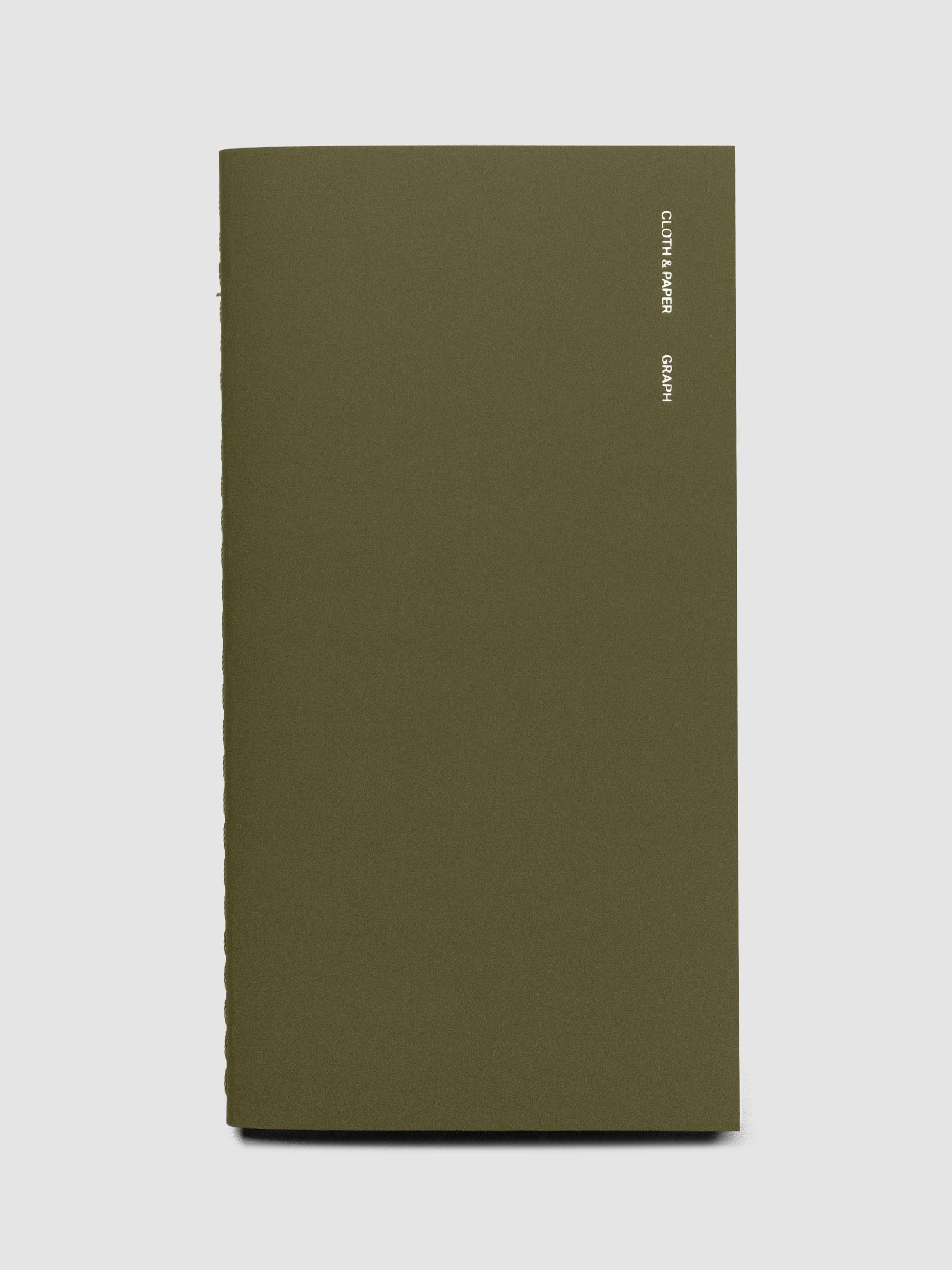 Travel Notebook | Pocket Plus with Graph Note page layouts in Olive green, showing the minimalist cover with foil branding and text.