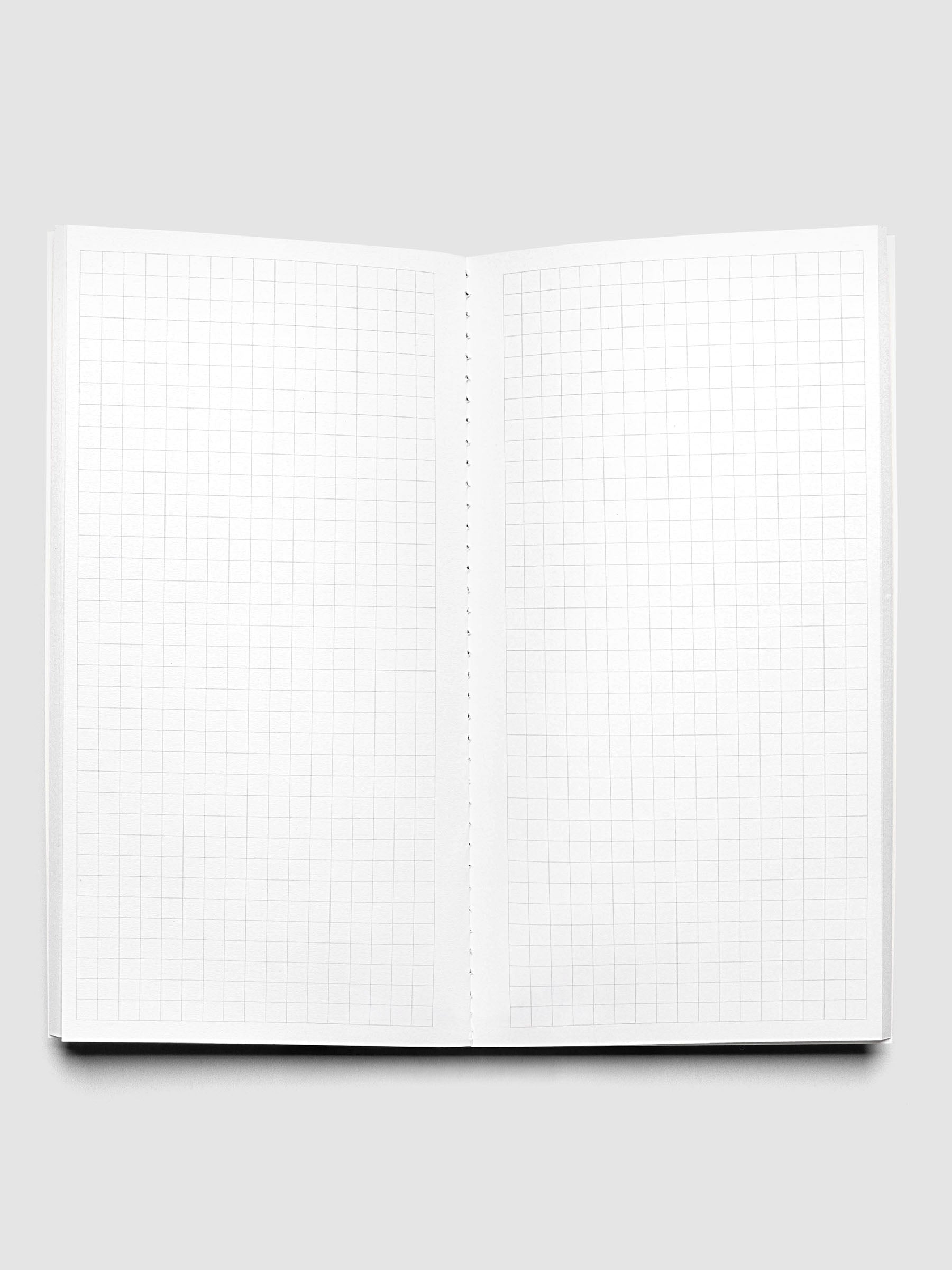 Travel Notebook | Pocket Plus with Graph Note page layouts in Olive green, showing the open notebook pages with graph lined pages.