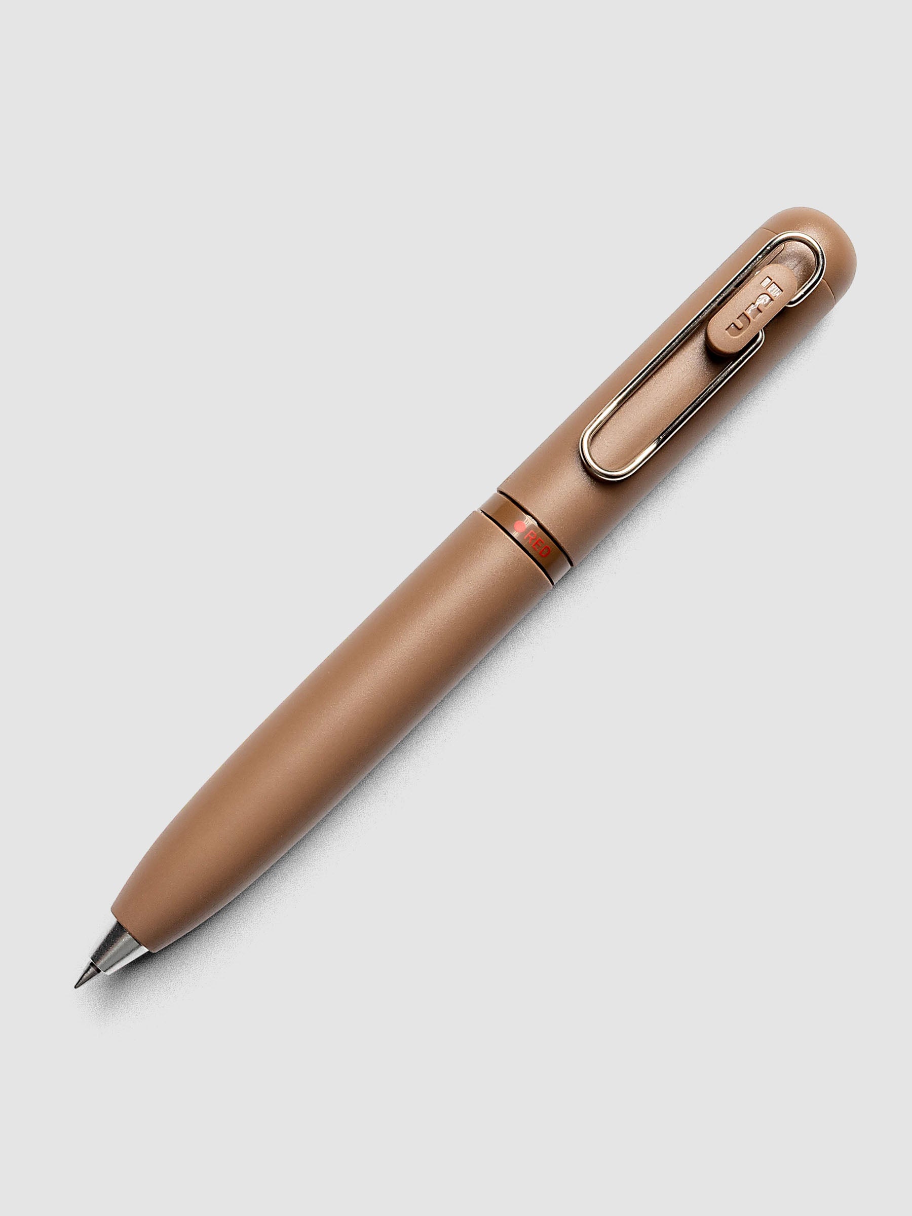 Uni-ball One 3-Color Ballpoint Pen in brown close up of barrel showing RED color indicator