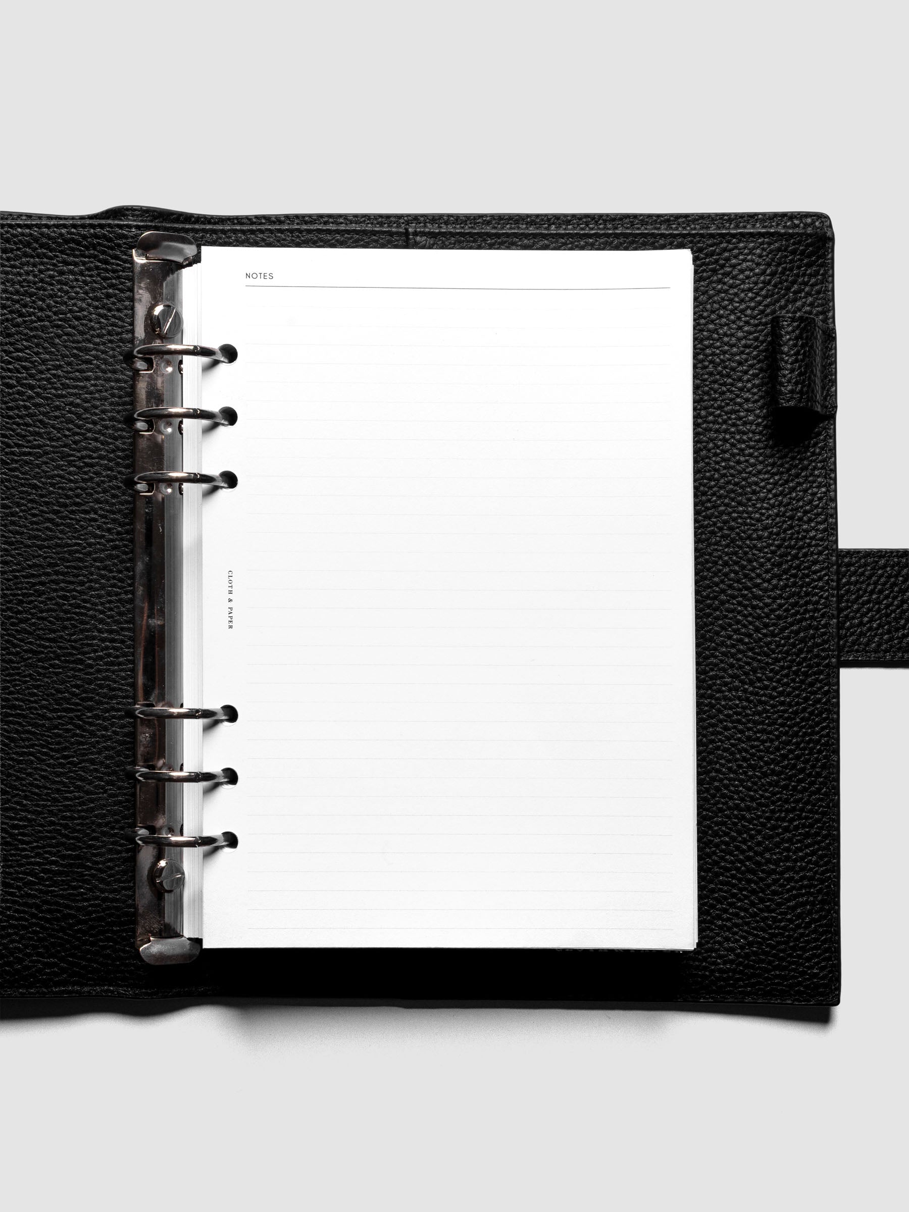 Notes page of the A5 Undated Weekly Notes Planner Inserts shown ringbound in a black leather agenda.