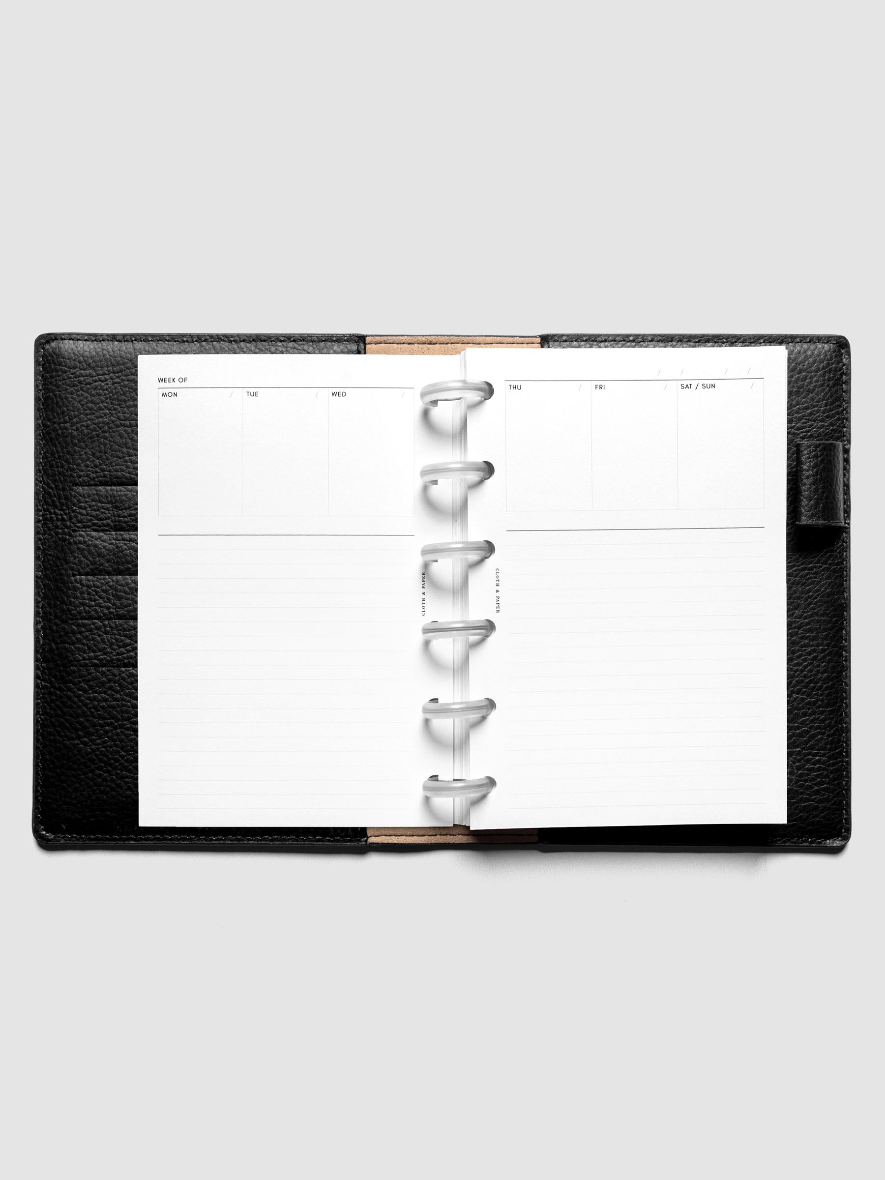 CP Petite Undated Weekly Notes Planner Inserts discbound in a black leather folio.