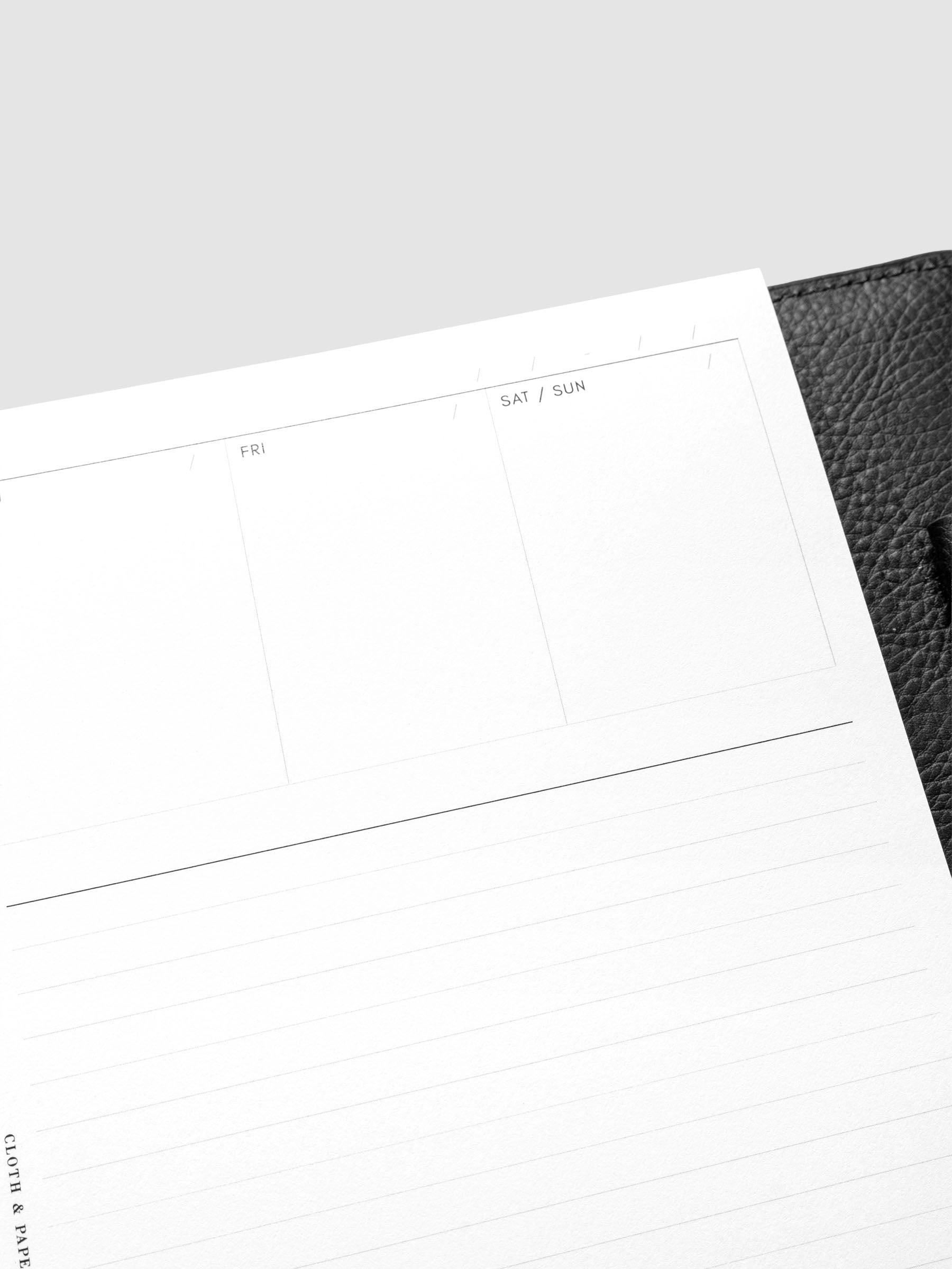 Close up view of the Undated Weekly Notes Planner Inserts showing sections for each day of the week, and a large lined notes section below.