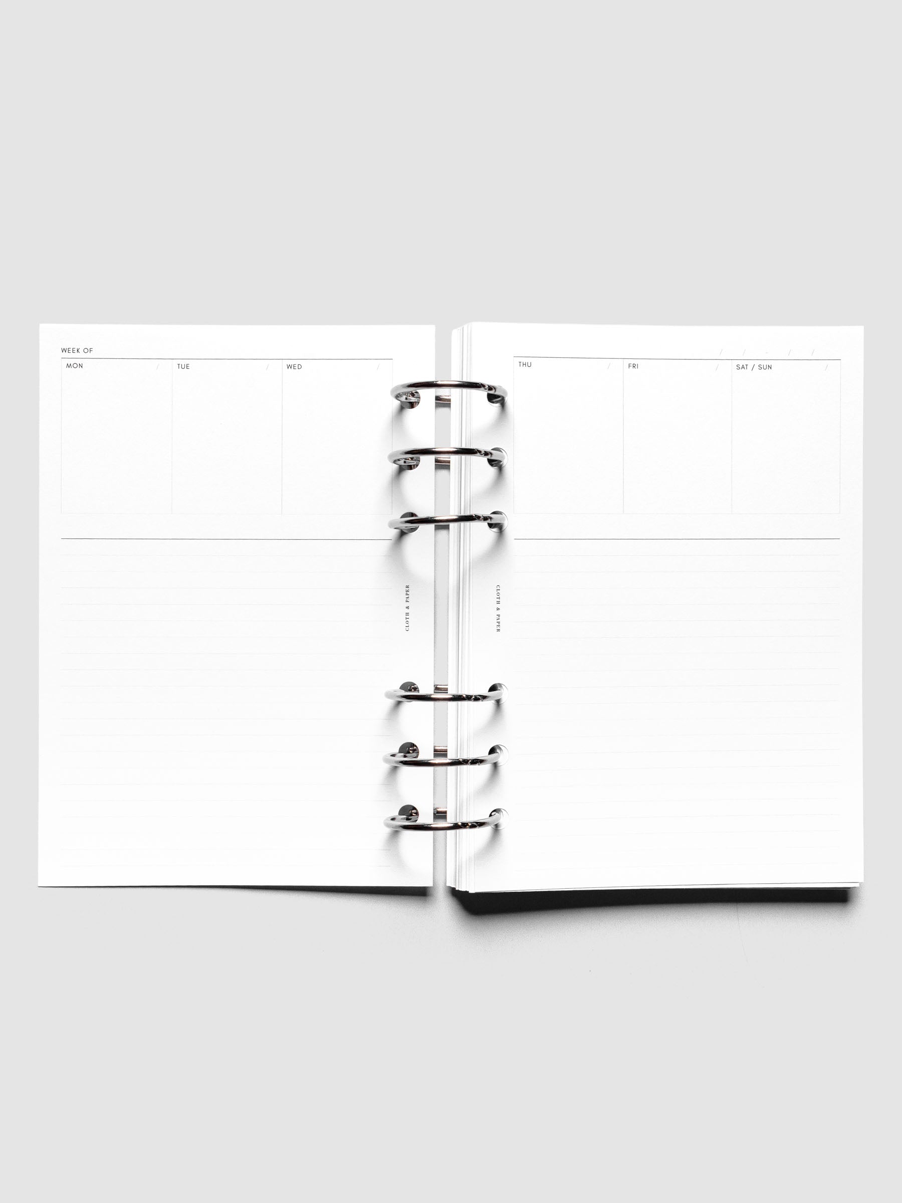 Personal Wide Undated Weekly Notes Planner Inserts shown ringbound.