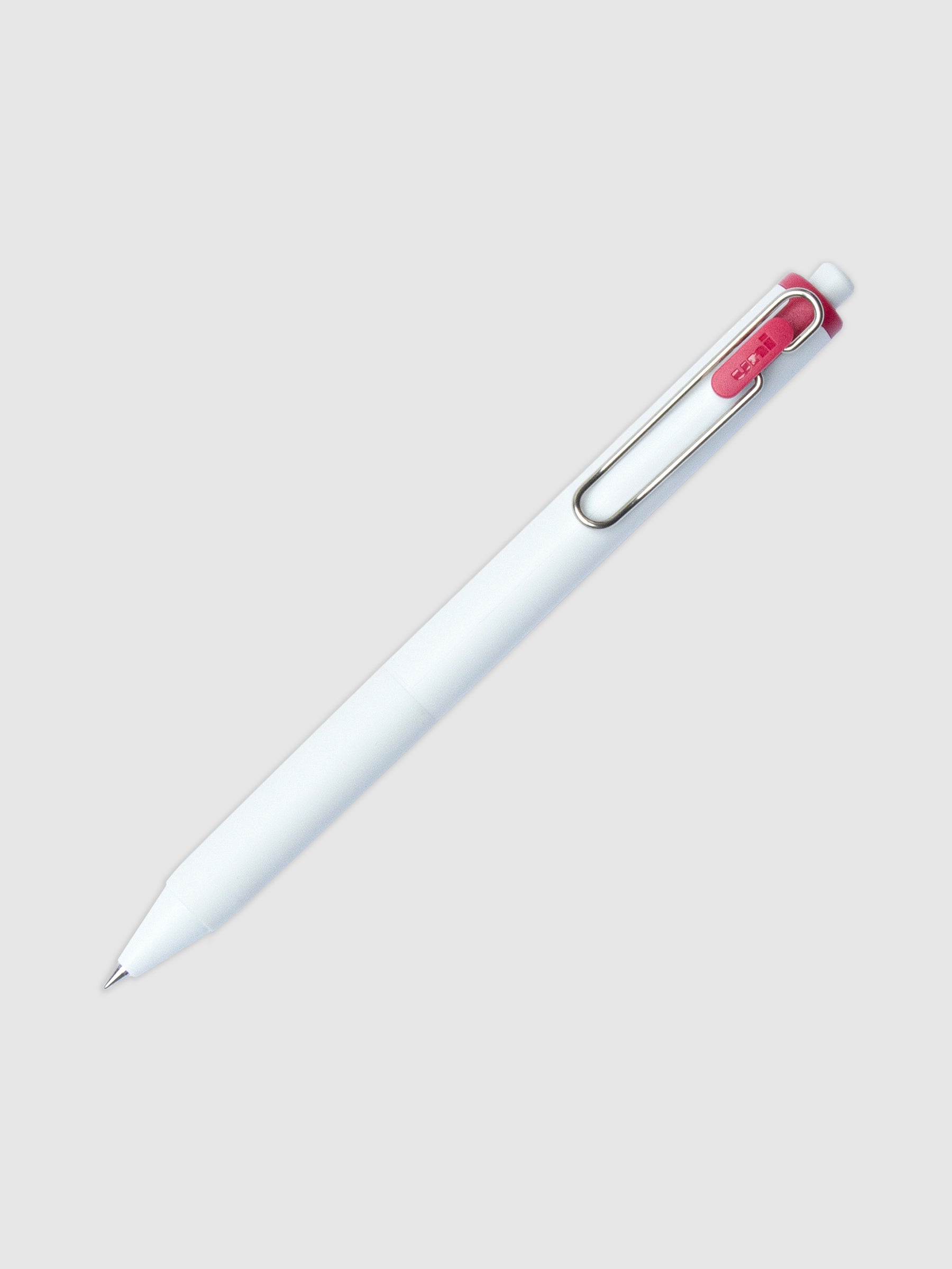 Uni-ball One Gel Pen, Anemone, Cloth and Paper. Pen tilted slightly to the right on a neutral background.