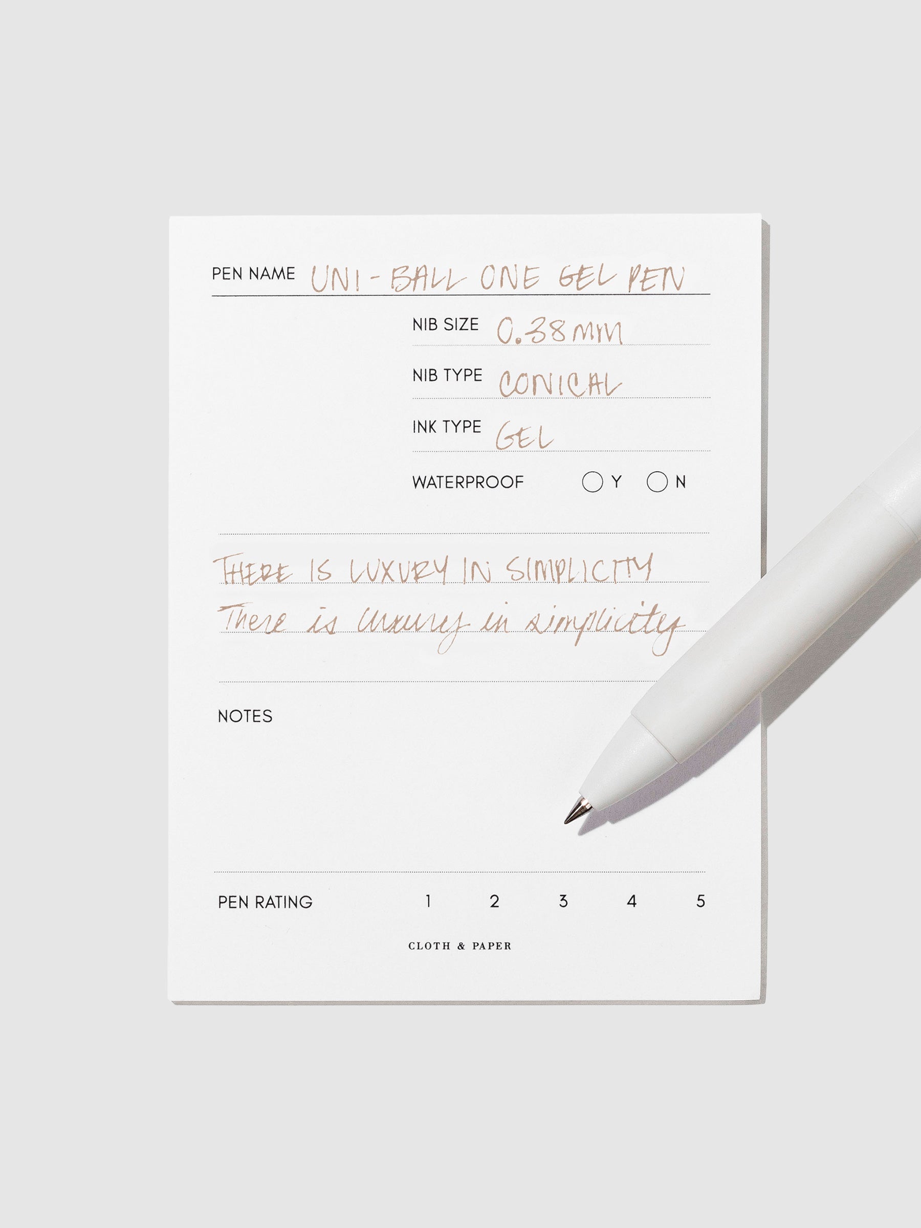 Pen tilted slightly to the right on a neutral background. Color pictured is Cappuccino Brown.