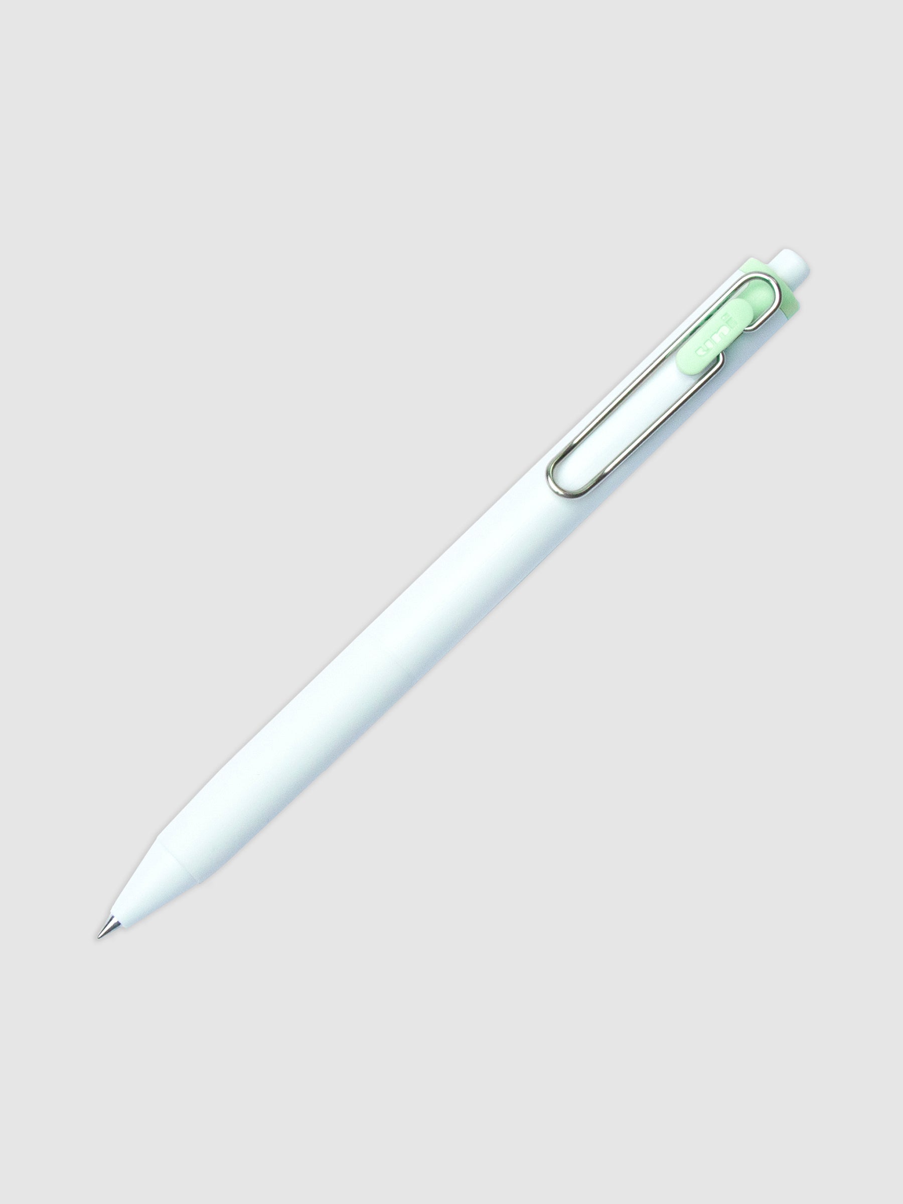 Uni-ball One Gel Pen, Green Car, Cloth and Paper. Pen tilted slightly to the right on a neutral background.