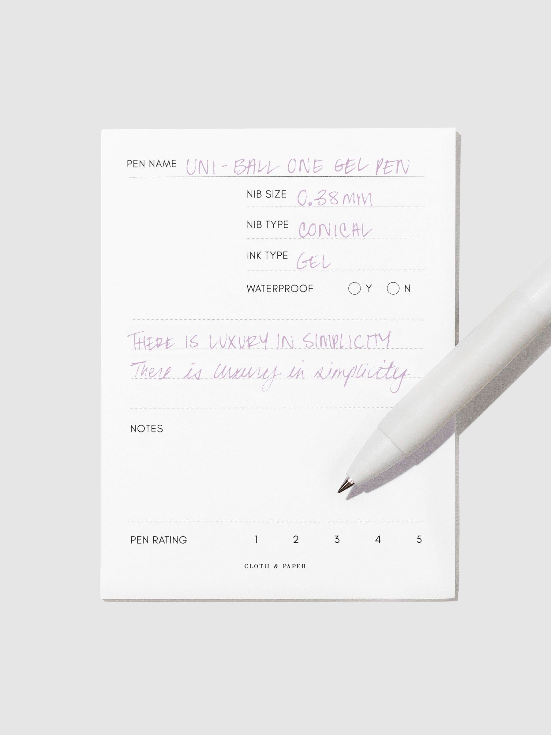 Pen tilted slightly to the right on a neutral background. Color pictured is Plum Purple.