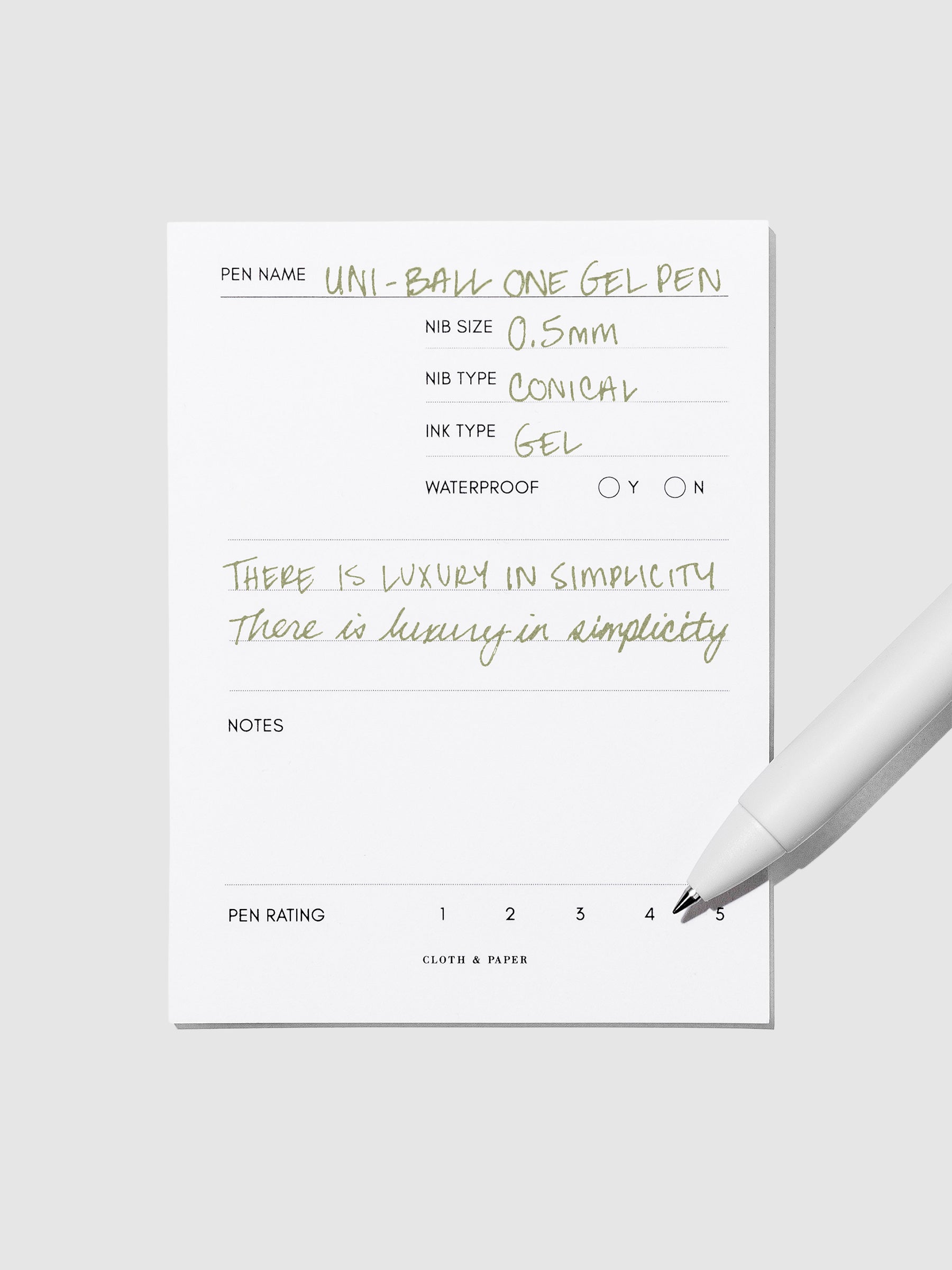 Pen tilted slightly to the right on a neutral background. Color pictured is Avocado Green.