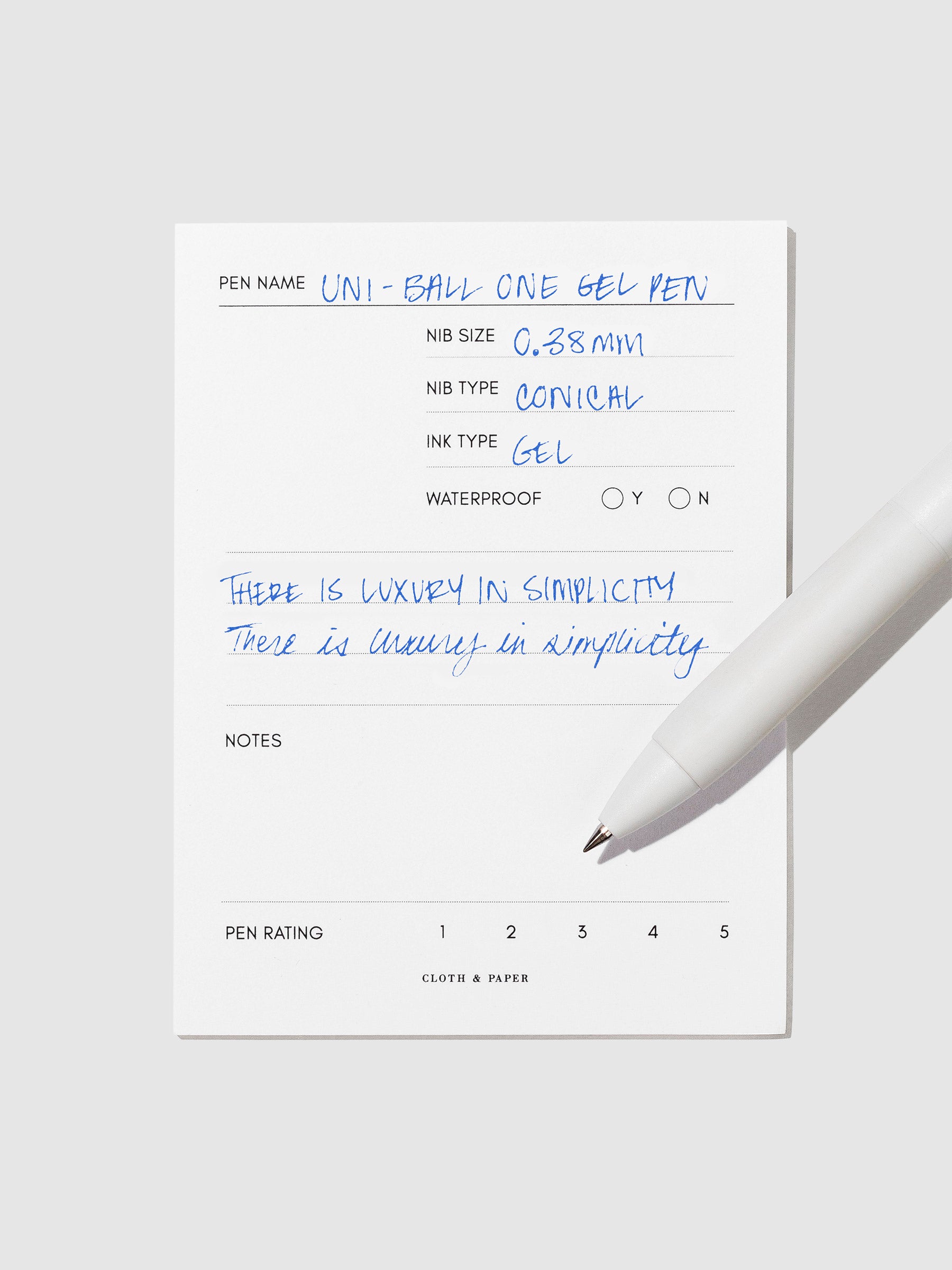 Pen tilted slightly to the right on a neutral background. Color pictured is Blue.