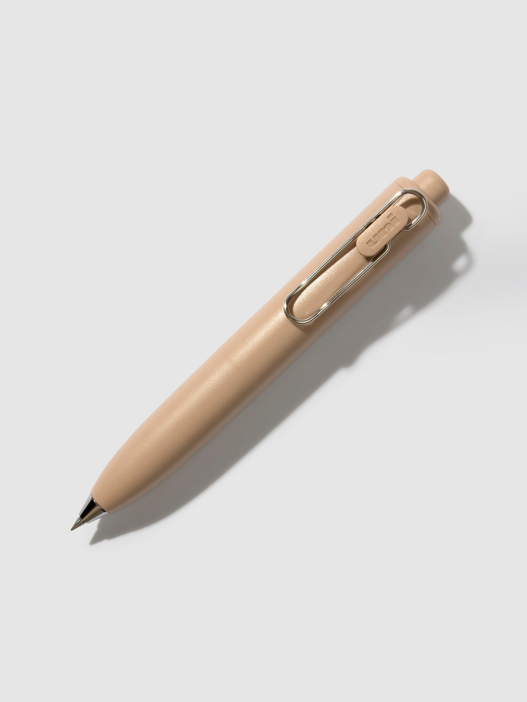 Uni-Ball One P Gel Pen, Cloth and Paper. Pen turned to the right on a neutral background. Color pictured is Coffee.