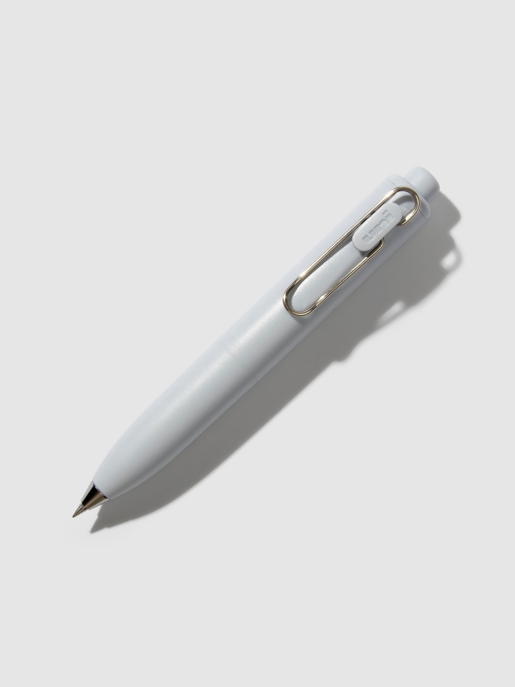 Uni-Ball One P Gel Pen, Cloth and Paper. Pen turned to the right on a neutral background. Color pictured is Soda.