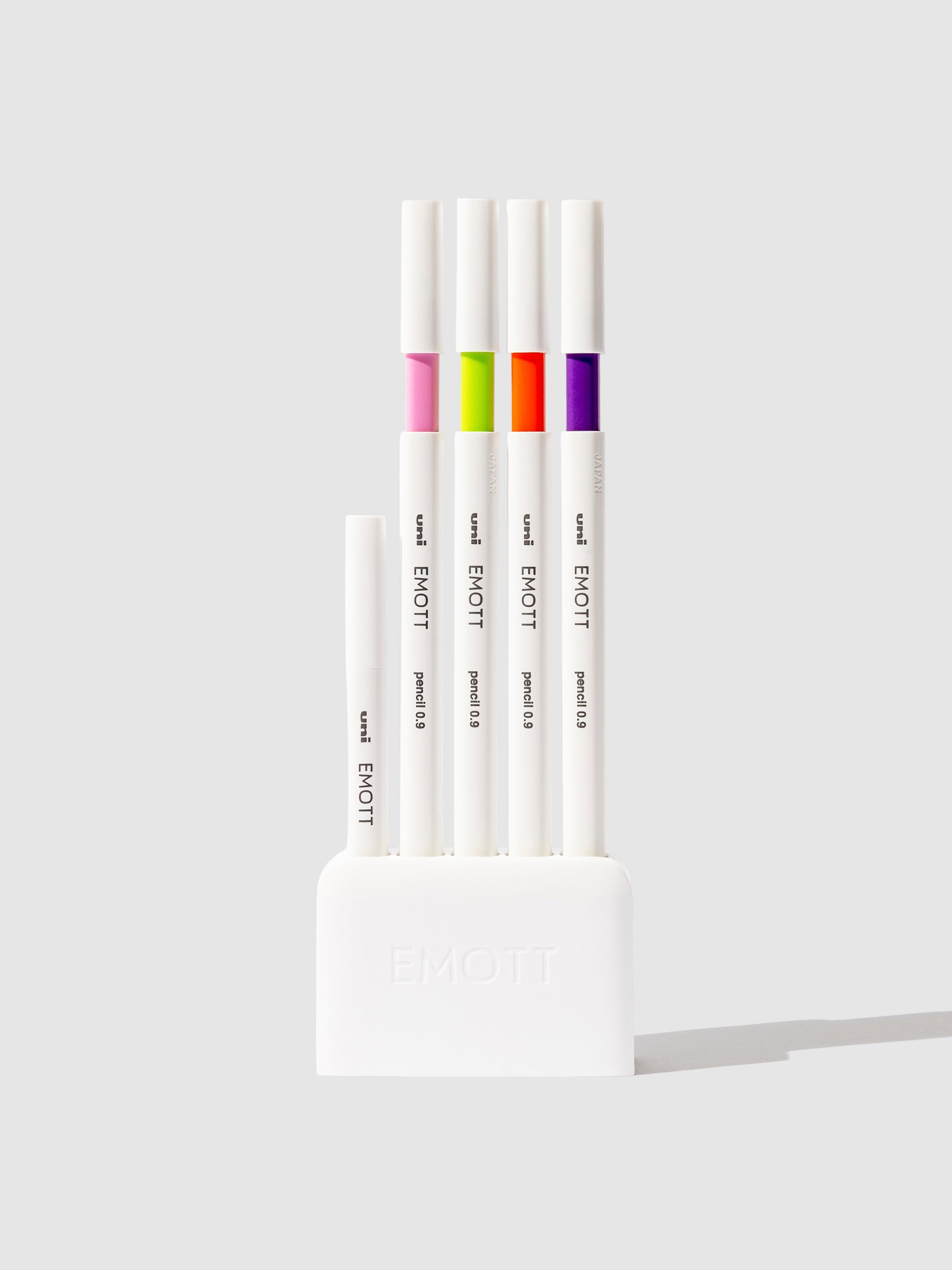 Tropical color pencils displayed on a neutral background.