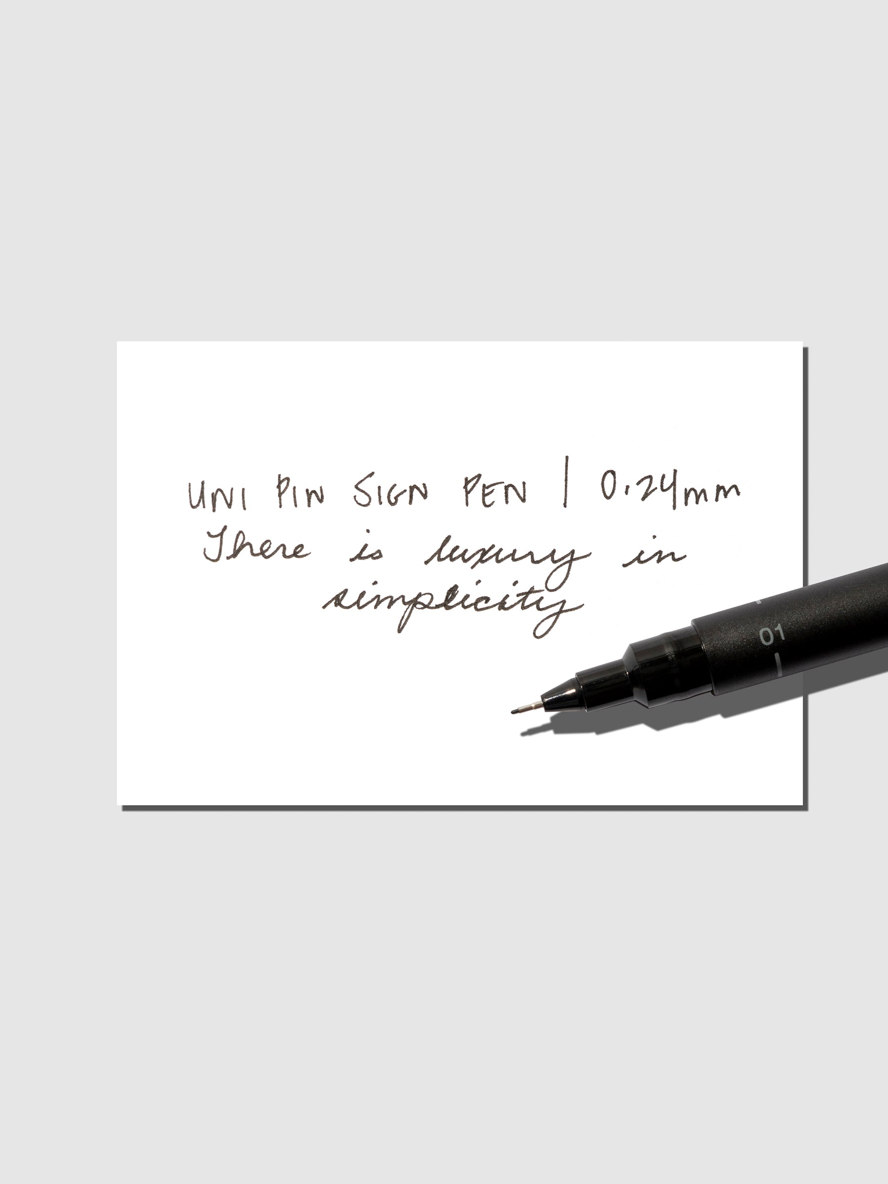 Pen shown resting on an in use tester sheet.