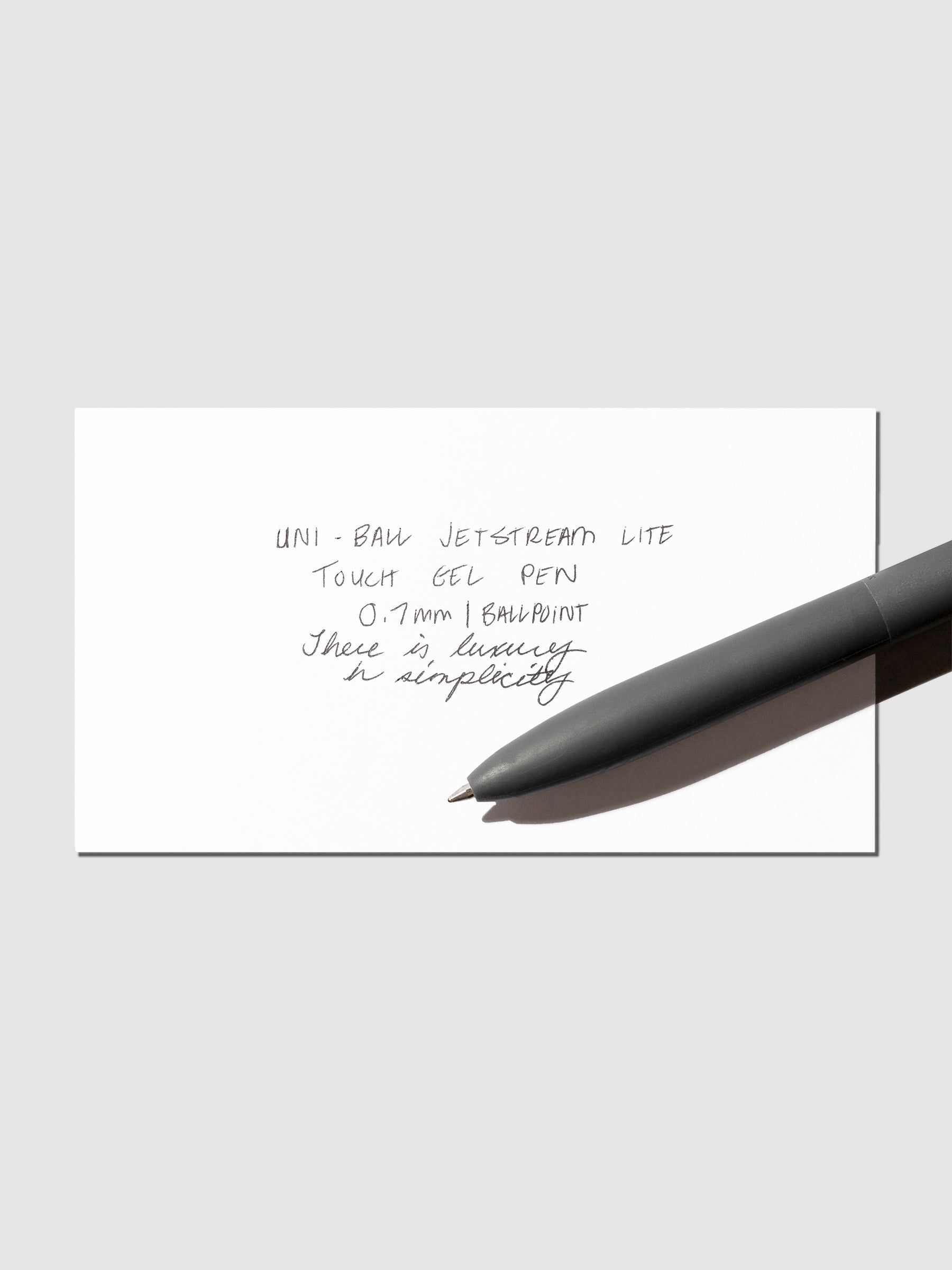 Image shows a pen test sheet of the Uni-ball Jetstream Lite Touch Gel Pen in Off Black.