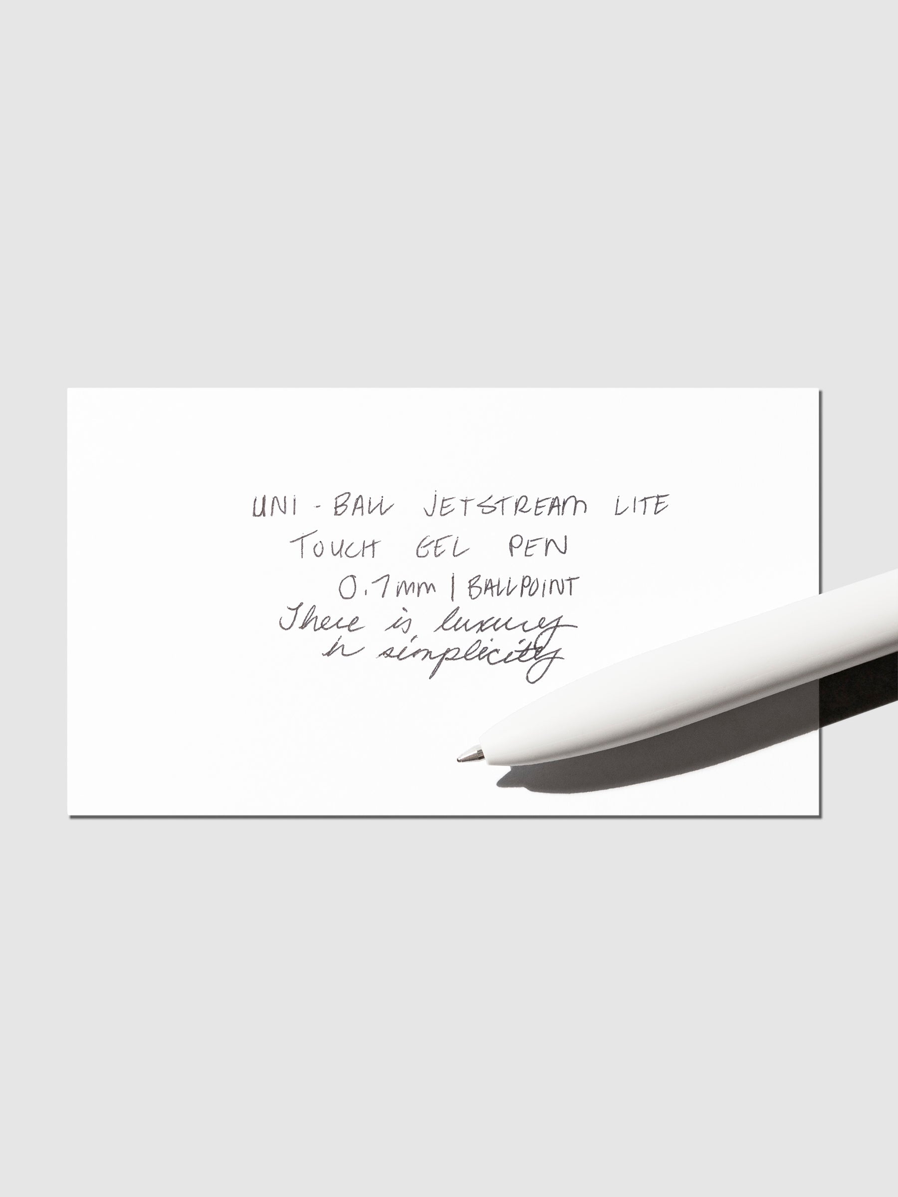 Image shows a pen test sheet of the Uni-ball Jetstream Lite Touch Gel Pen in Shell White.