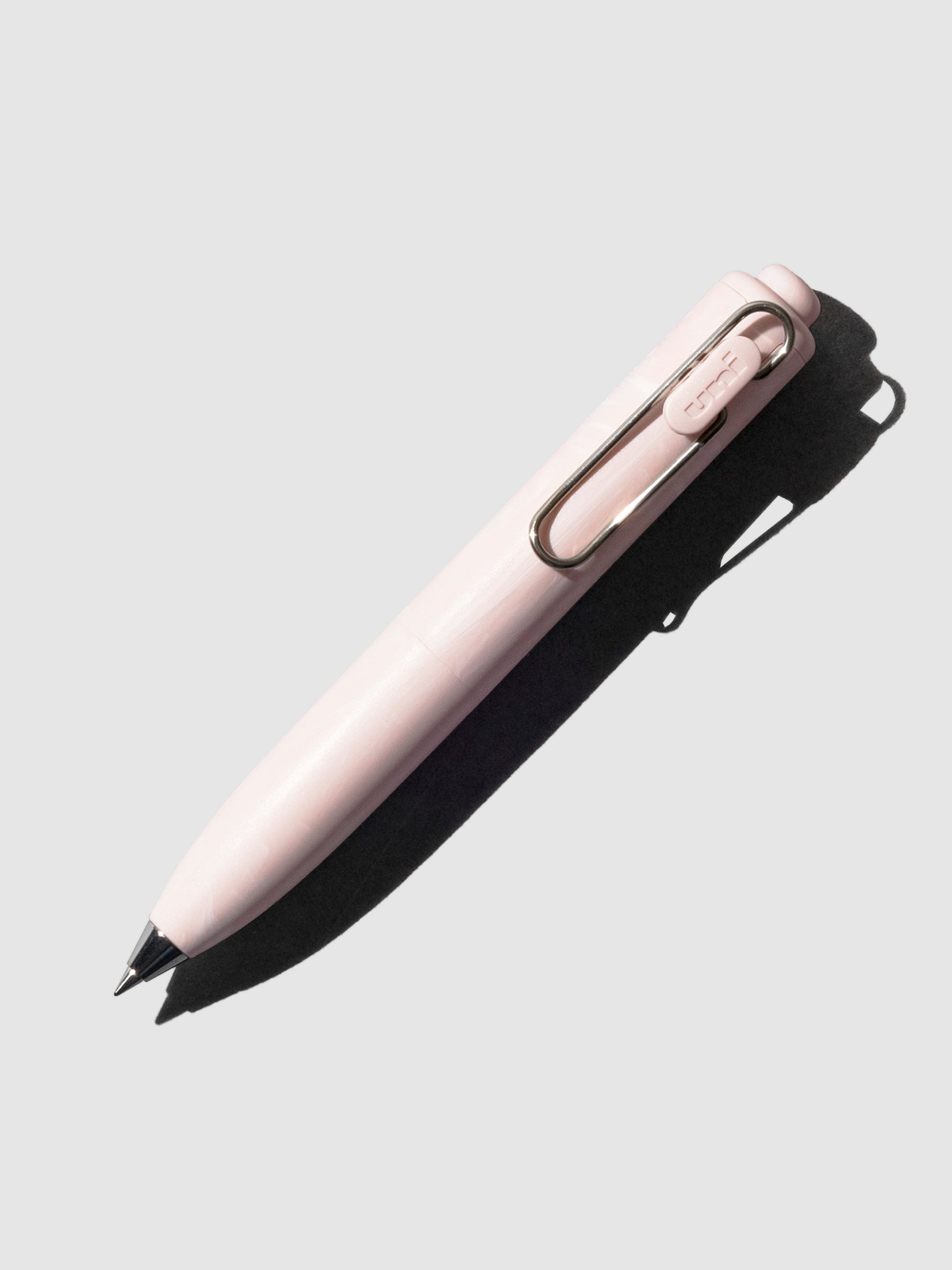 Uni-Ball One P Gel Pen, Cloth and Paper. Pen turned to the right on a neutral background. Color pictured is  Peony.