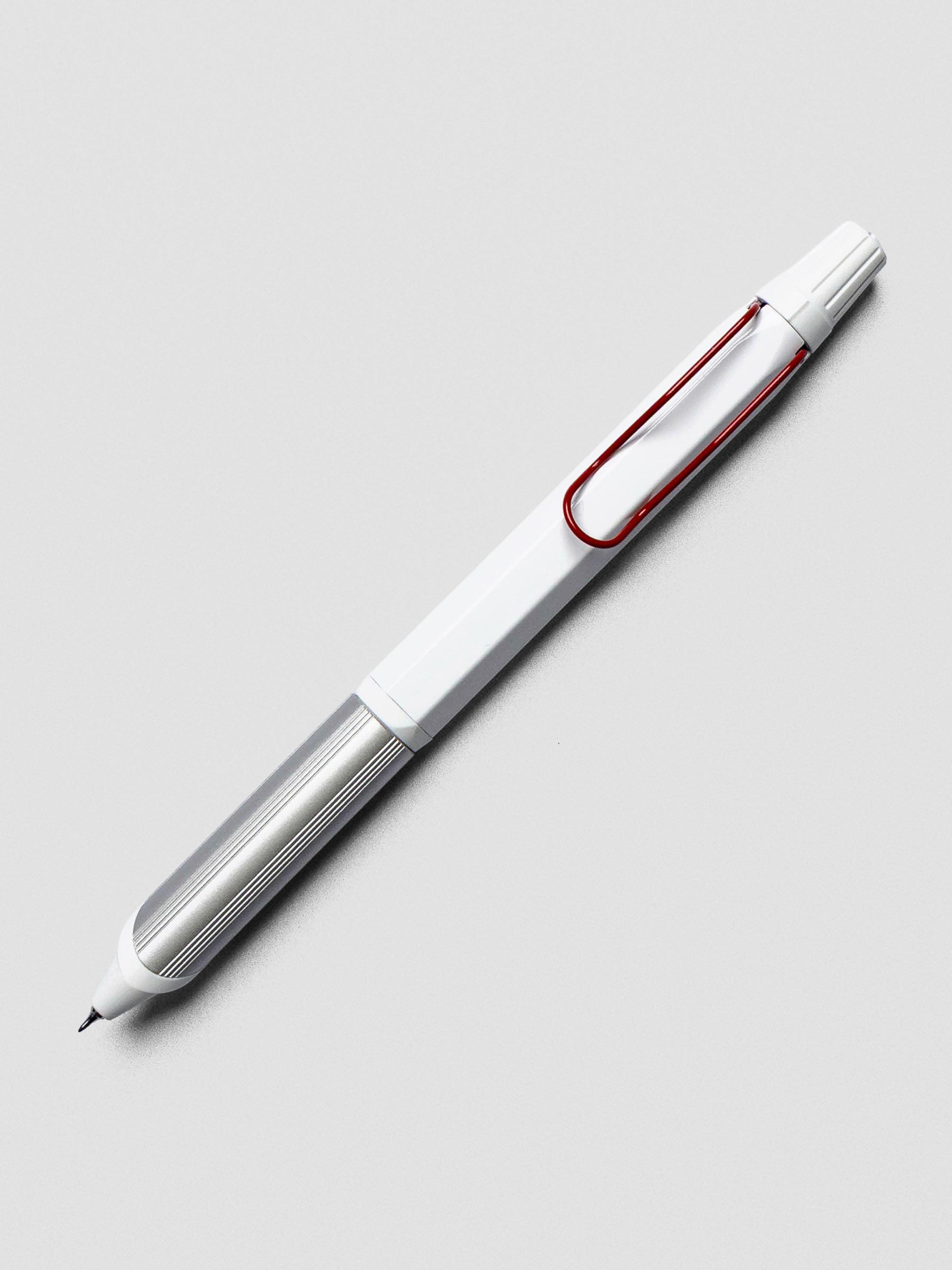 Ballpoint multi-pen with white body, silver grip, and red clip shown at an angle on a grey background.