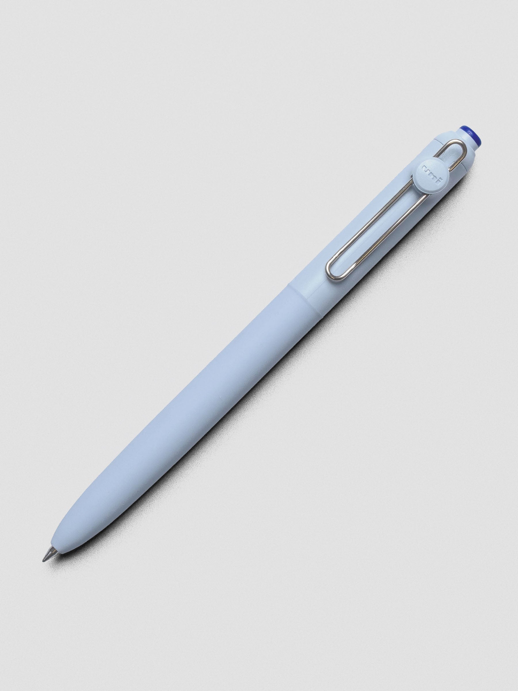 Blue pen shown at an angle with a silver clip.
