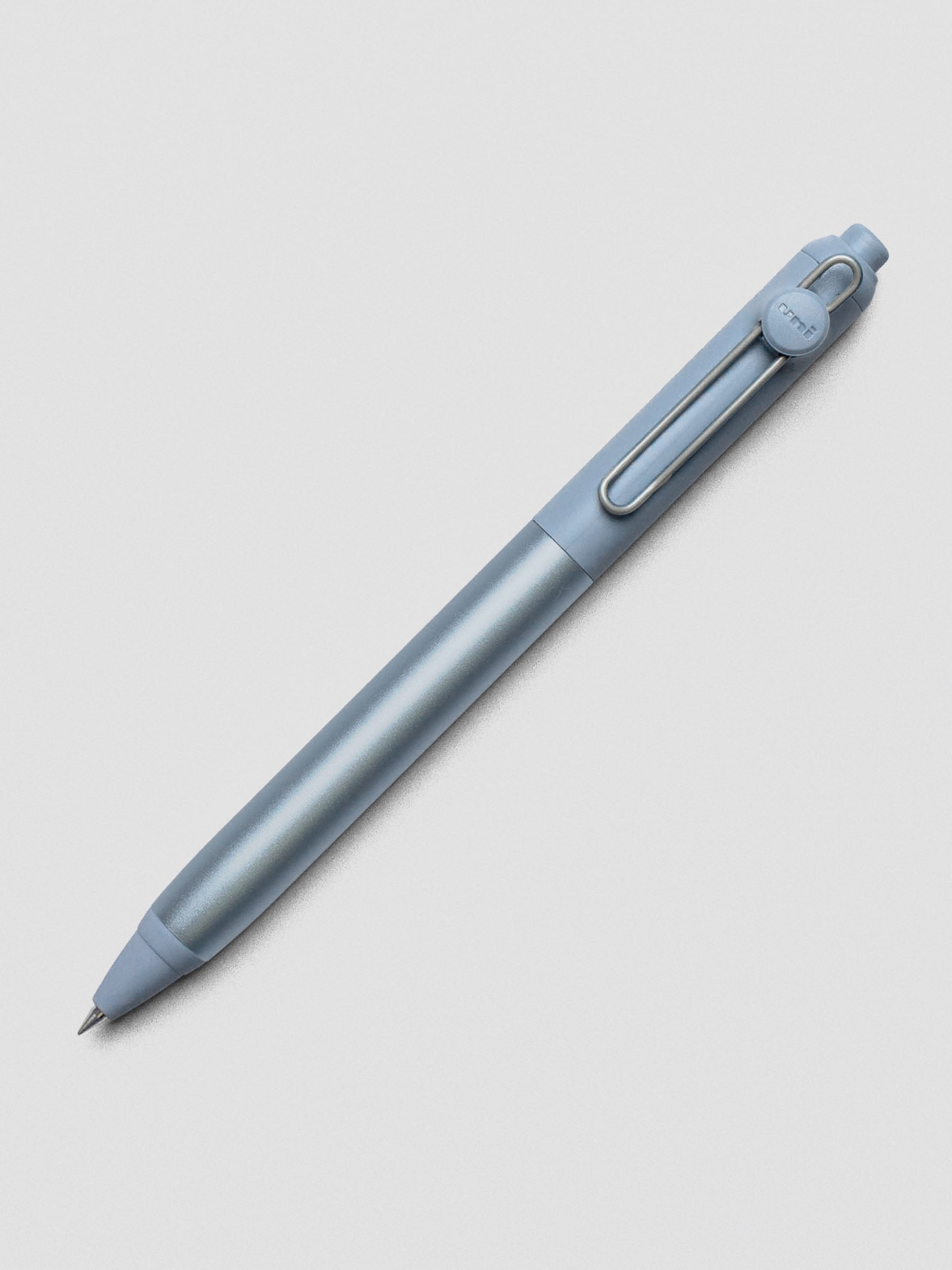 Light blue pen shown at an angle on a grey background.