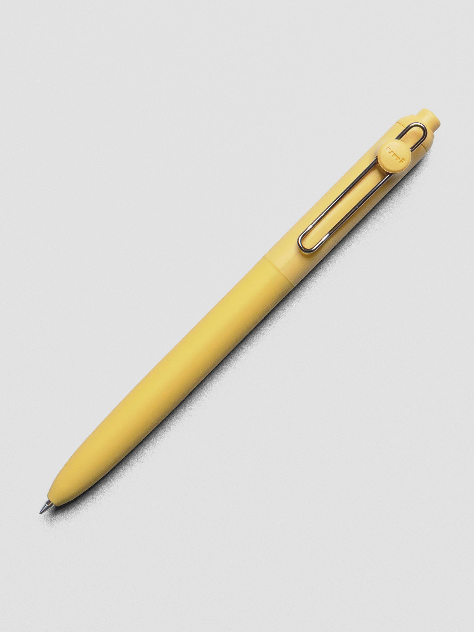 Yellow pen with a silver clip shown at an angle.