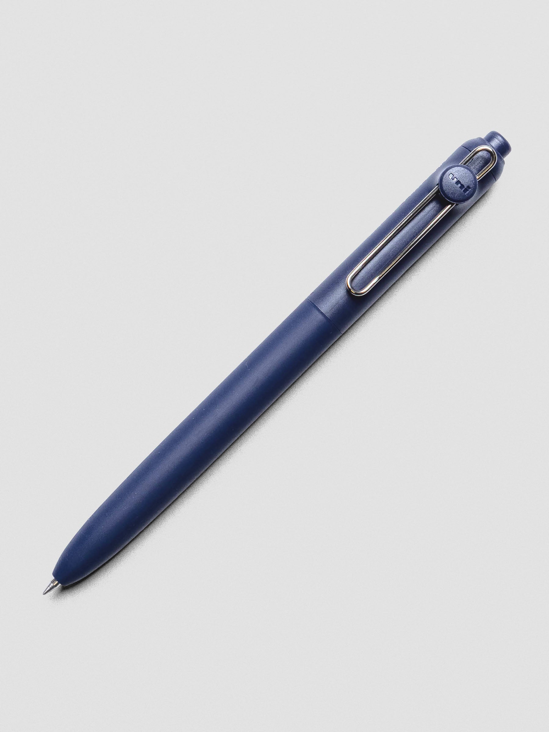 Dark blue pen with a silver clip shown at an angle.