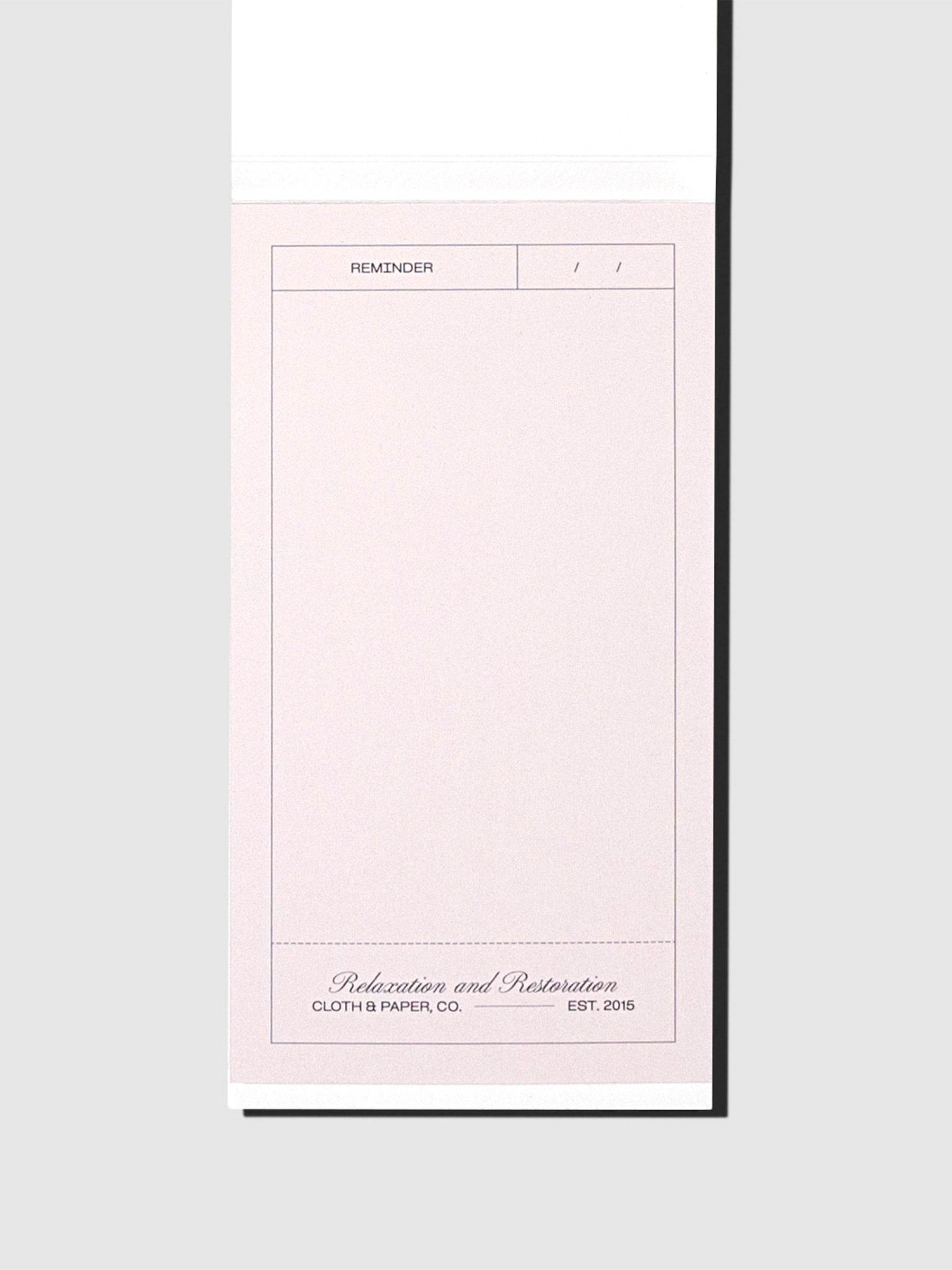 Sticky note displayed on its backing on a neutral background.