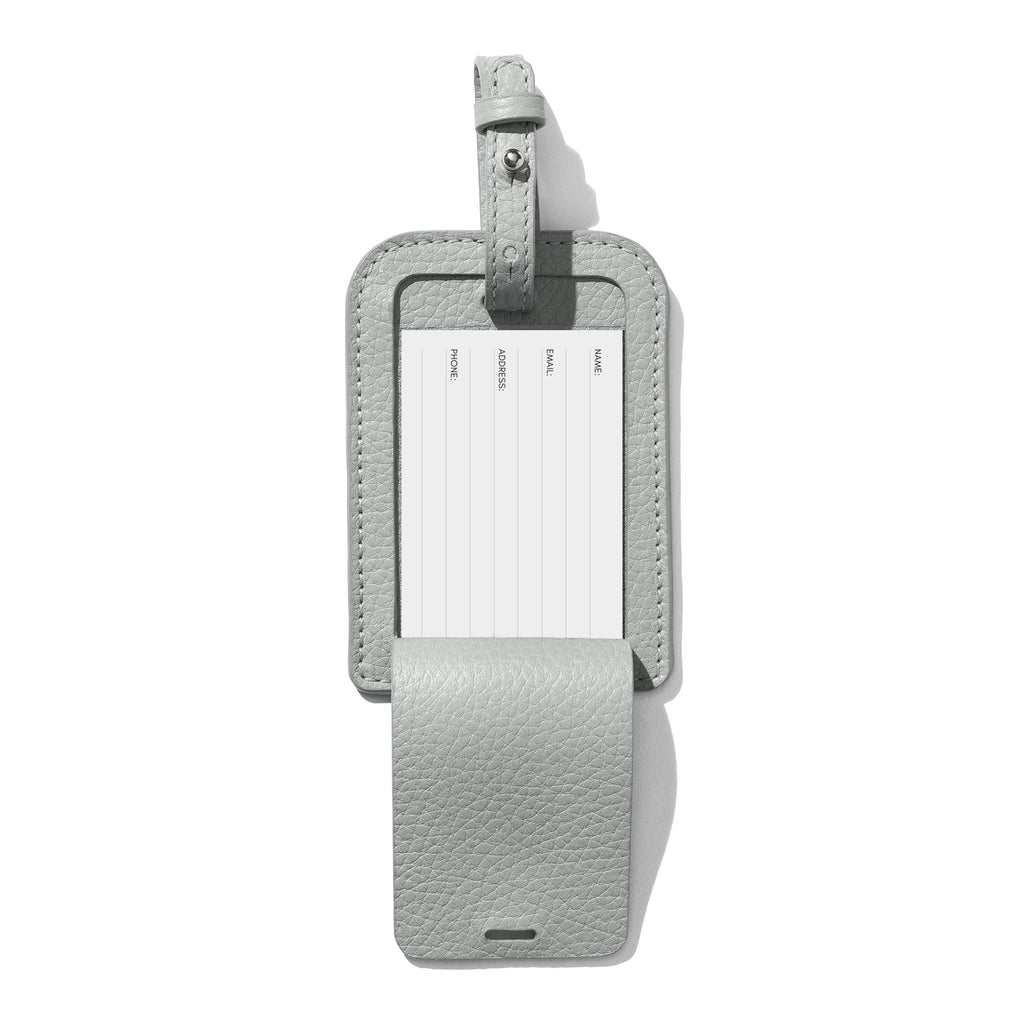 Heirloom Luggage Tag - Veleta in a white background revealing essential travel information: neatly inscribed name, email, address, and phone number on a crisp paper insert.