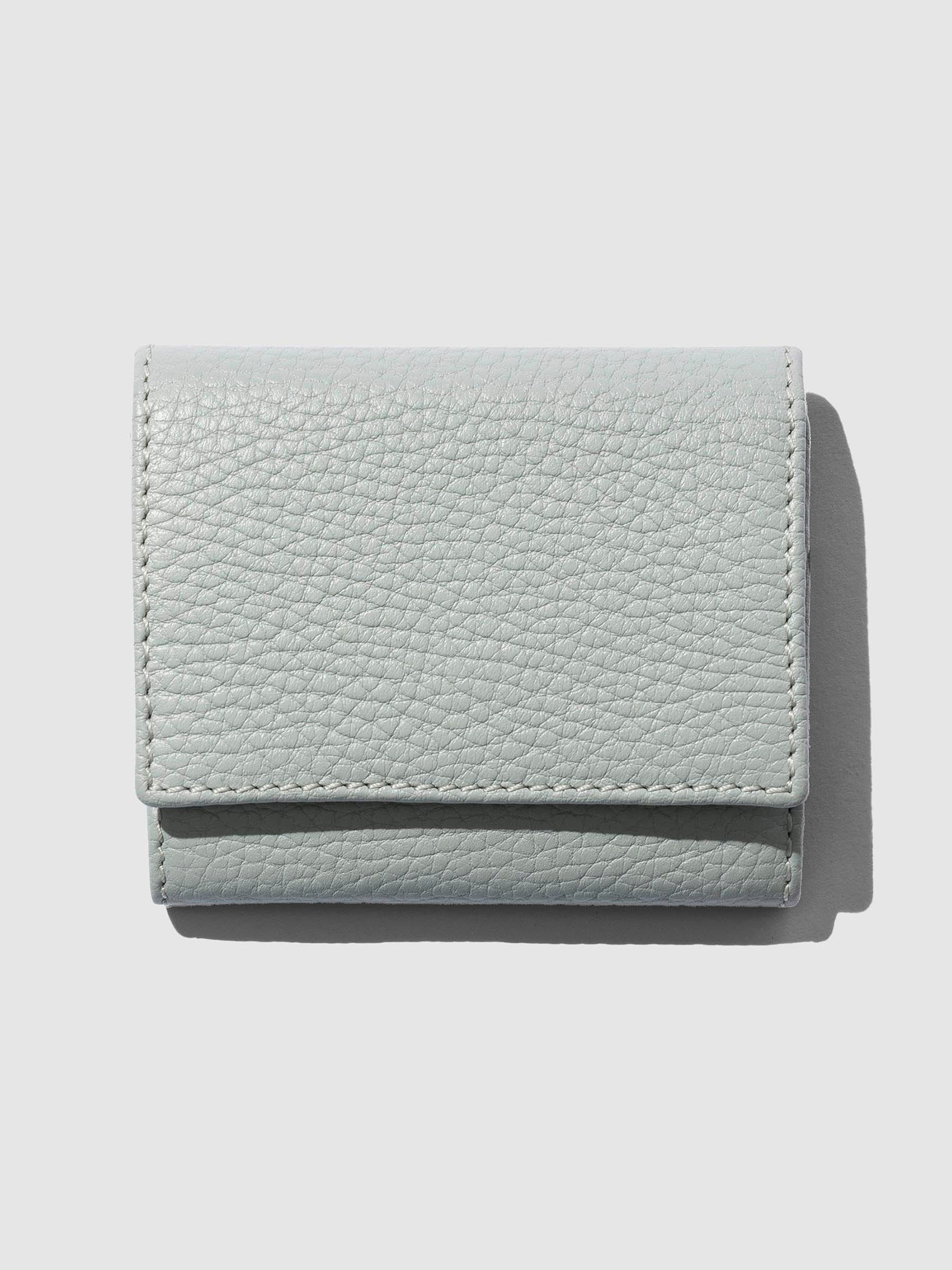 Leather wallet displayed on a neutral background.