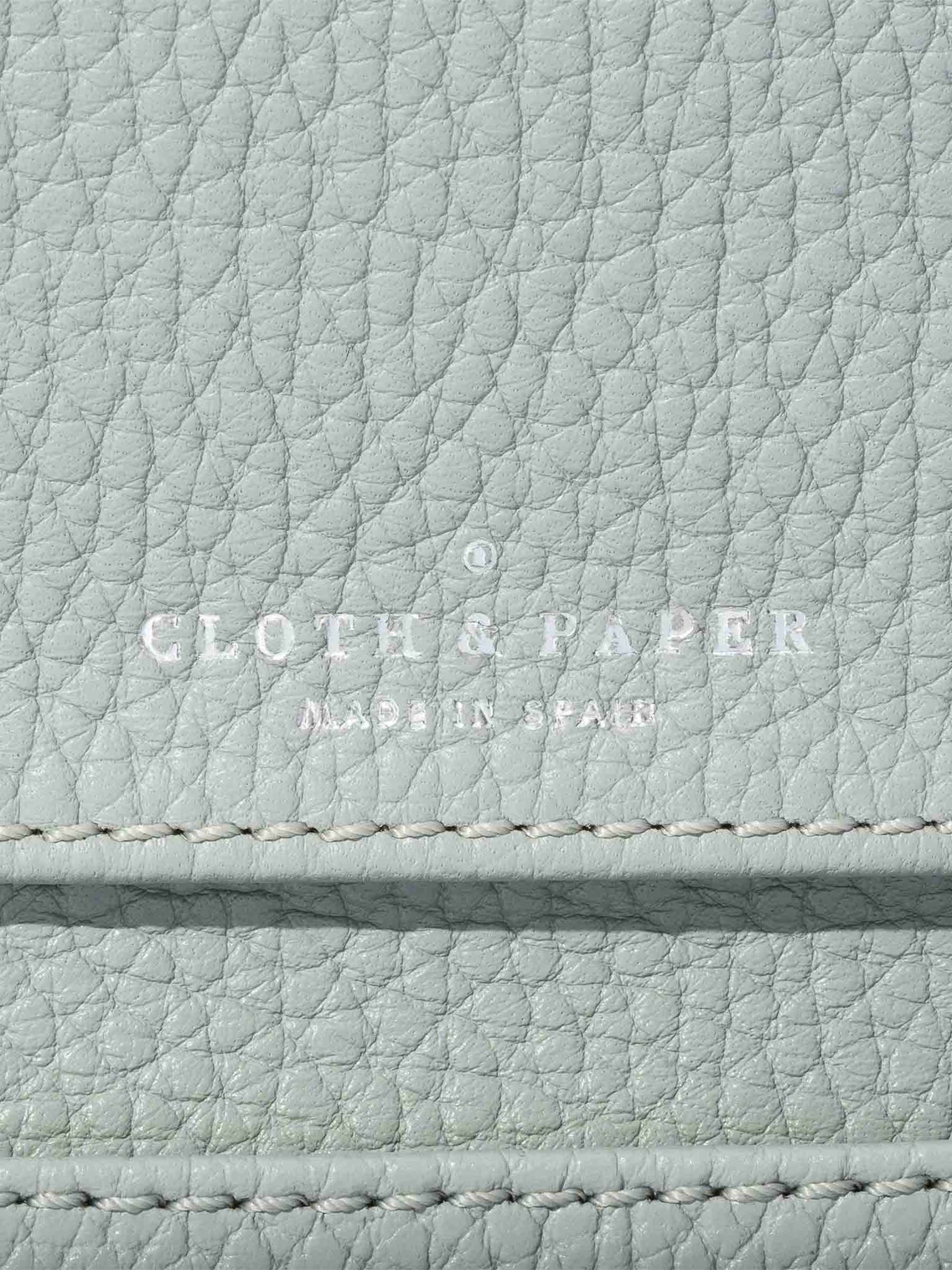 Closeup of embossing on leather wallet.