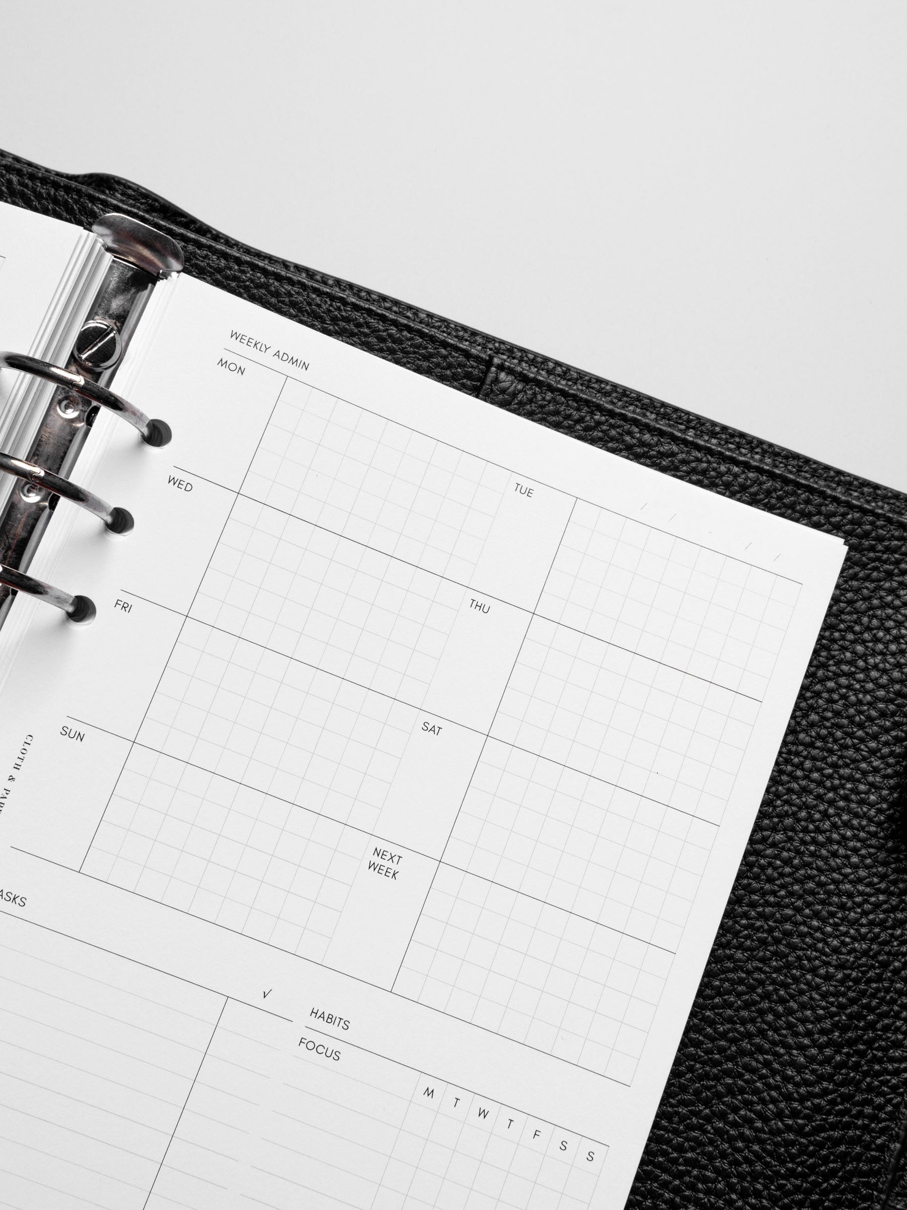 Insert in use inside a black leather planner.