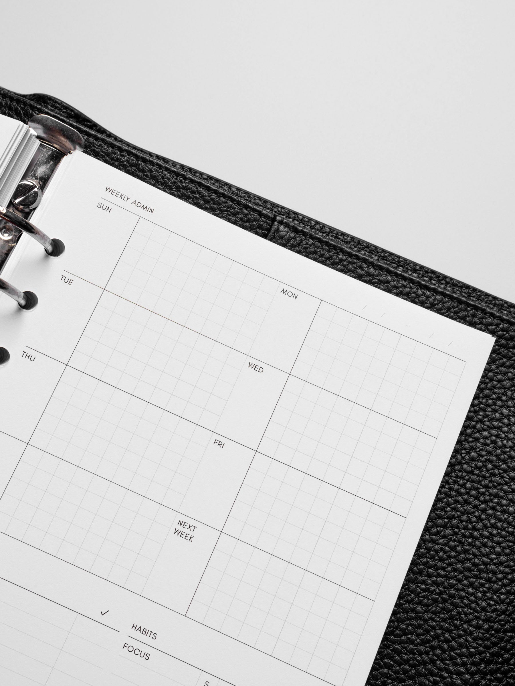 Insert in use inside a black leather planner.