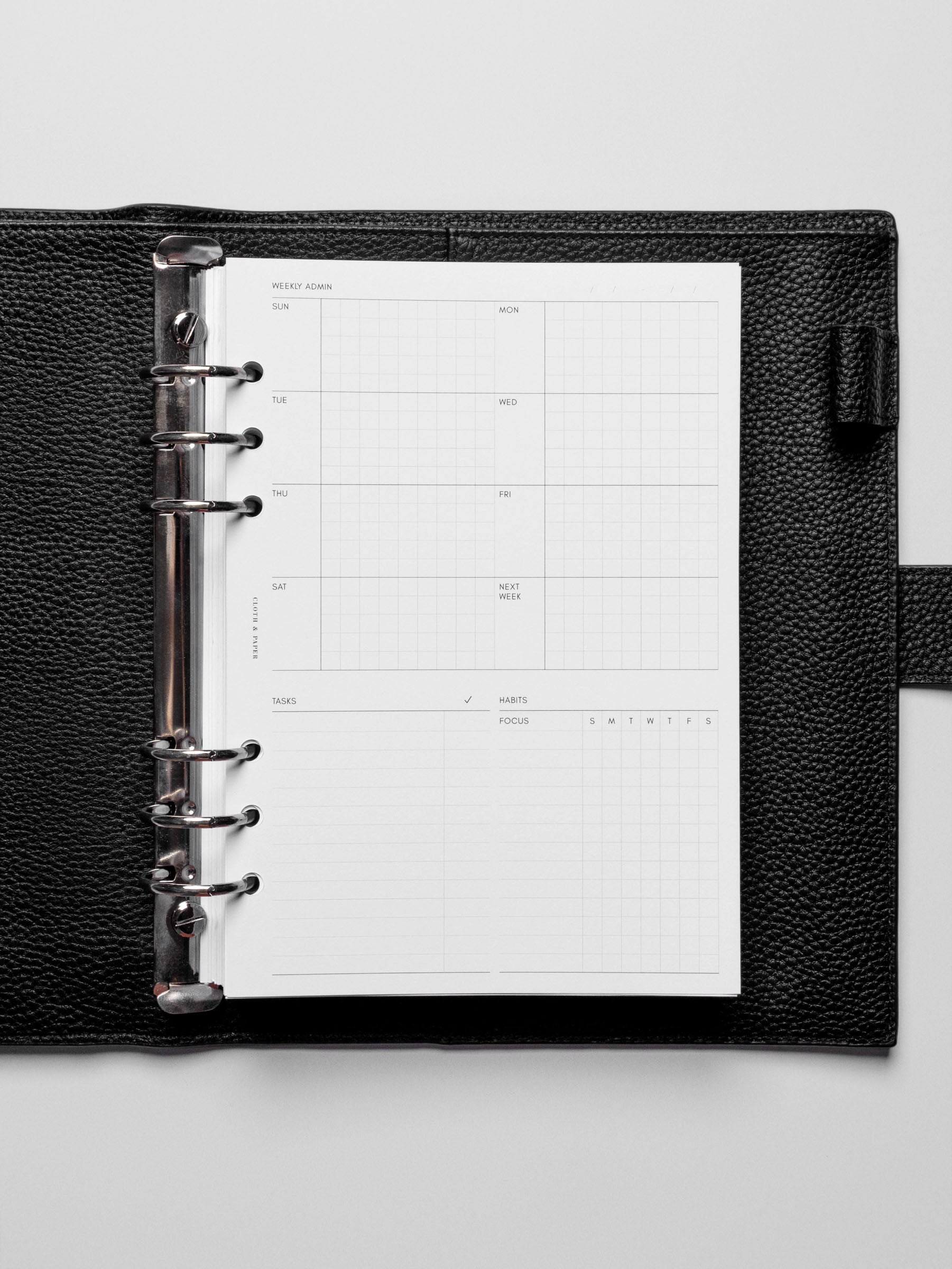 Insert in use inside a black leather planner.