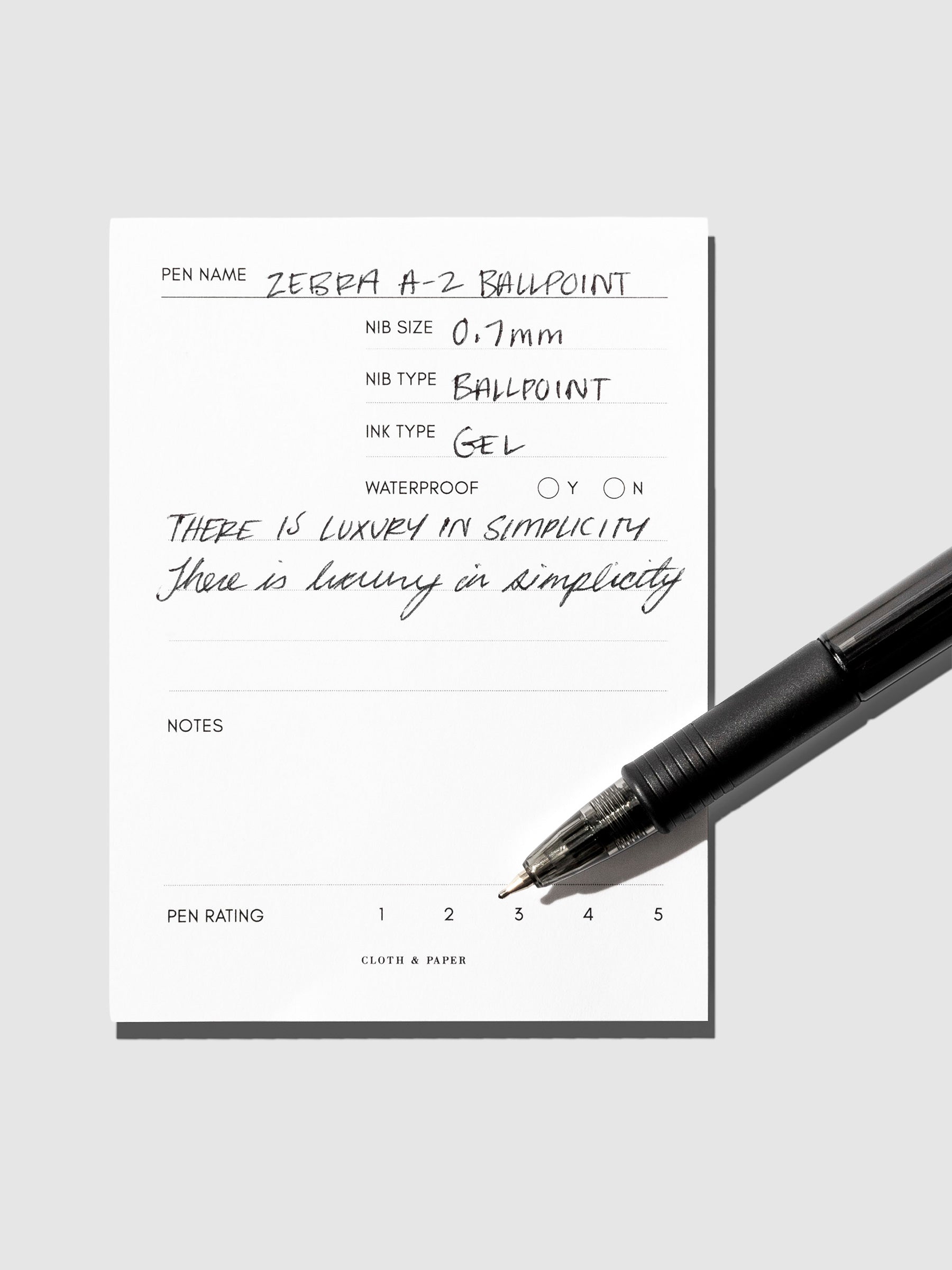 Pen resting on in use pen testing sheet.