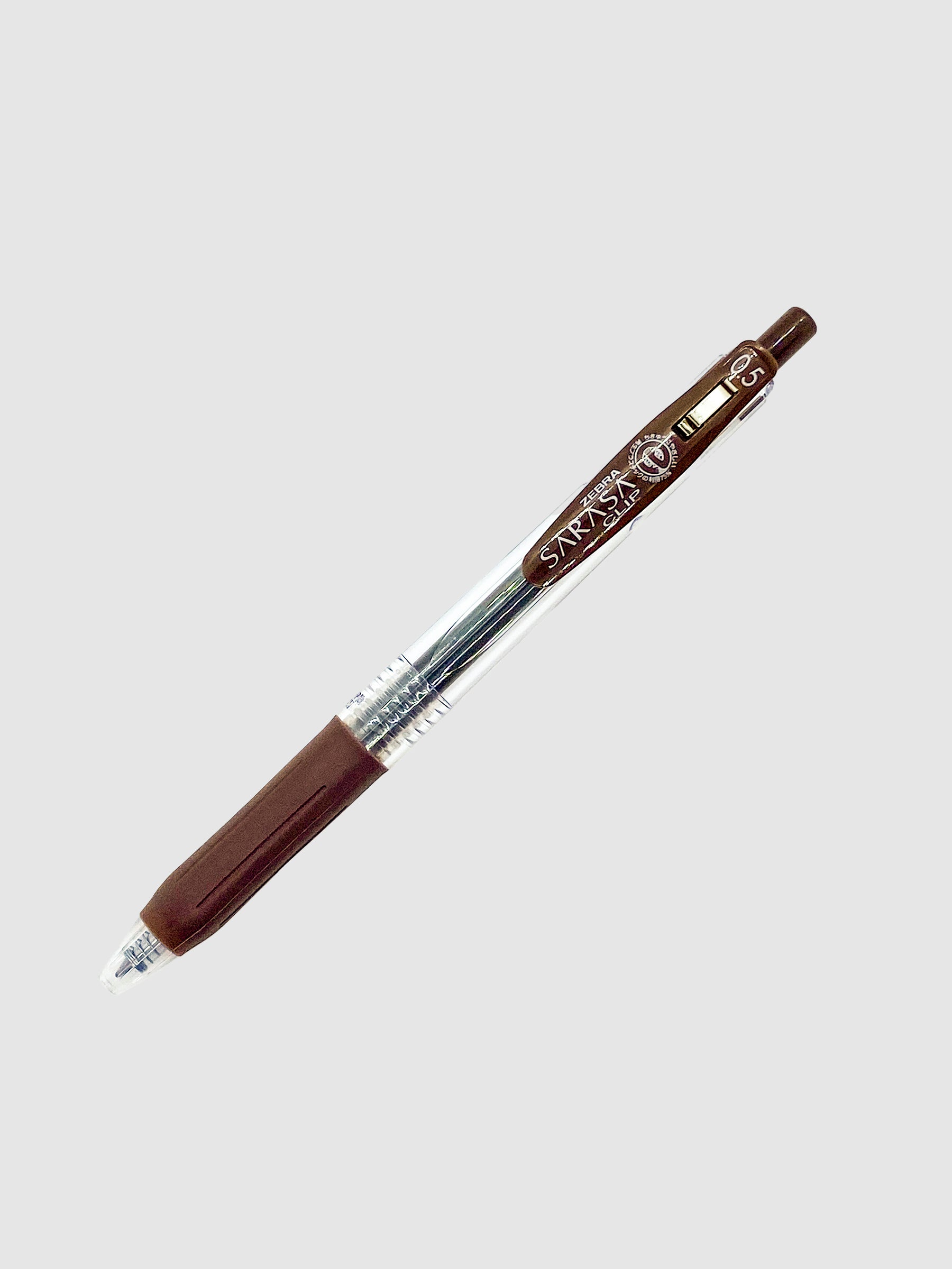 Zebra Sarasa Clip, 0.5 mm, Brown, Cloth and Paper. Pen turned to the right against a neutral background.