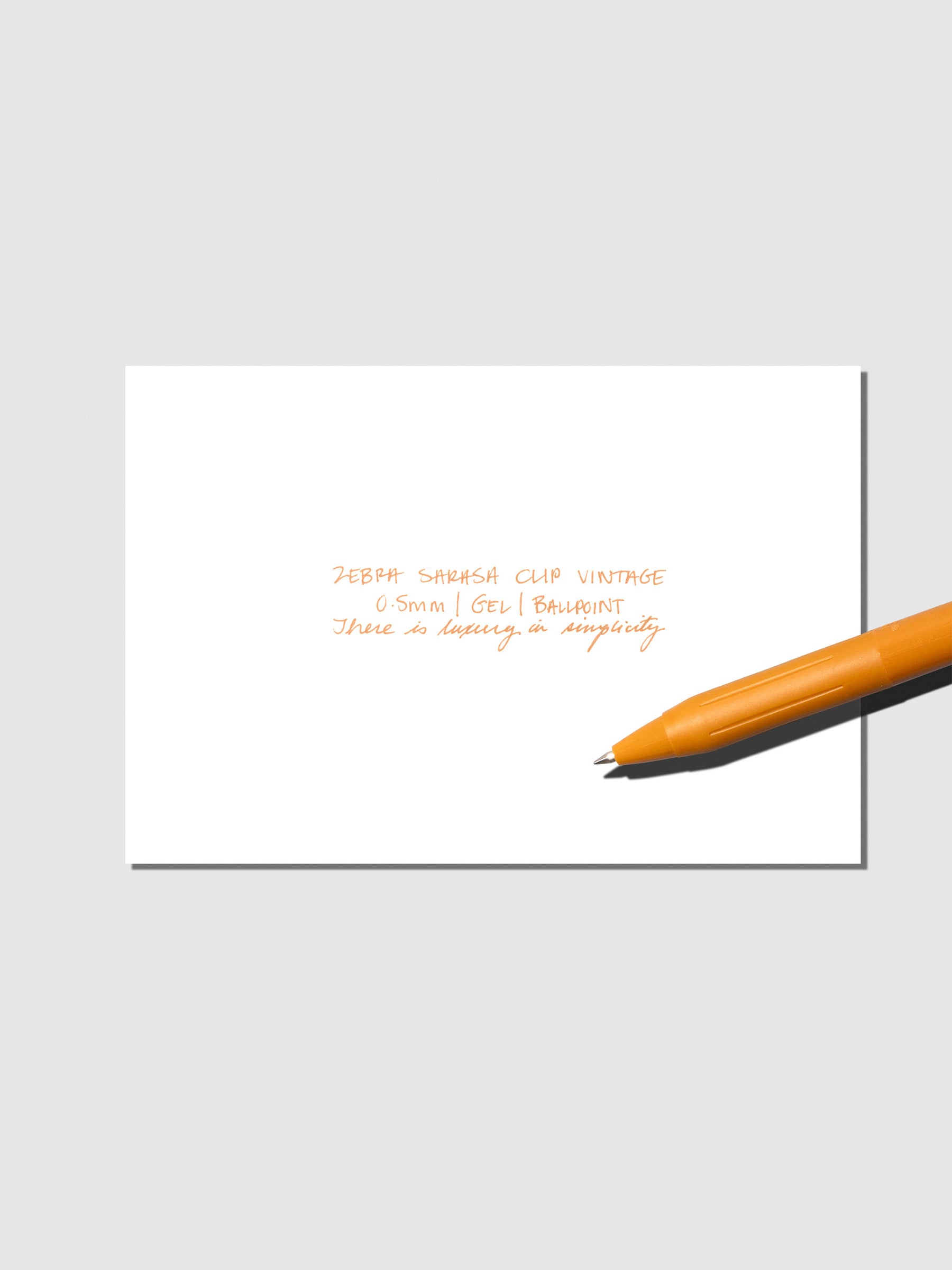 Pen testing sheet displayed with pen on a neutral background. Color shown is Camel Yellow.
