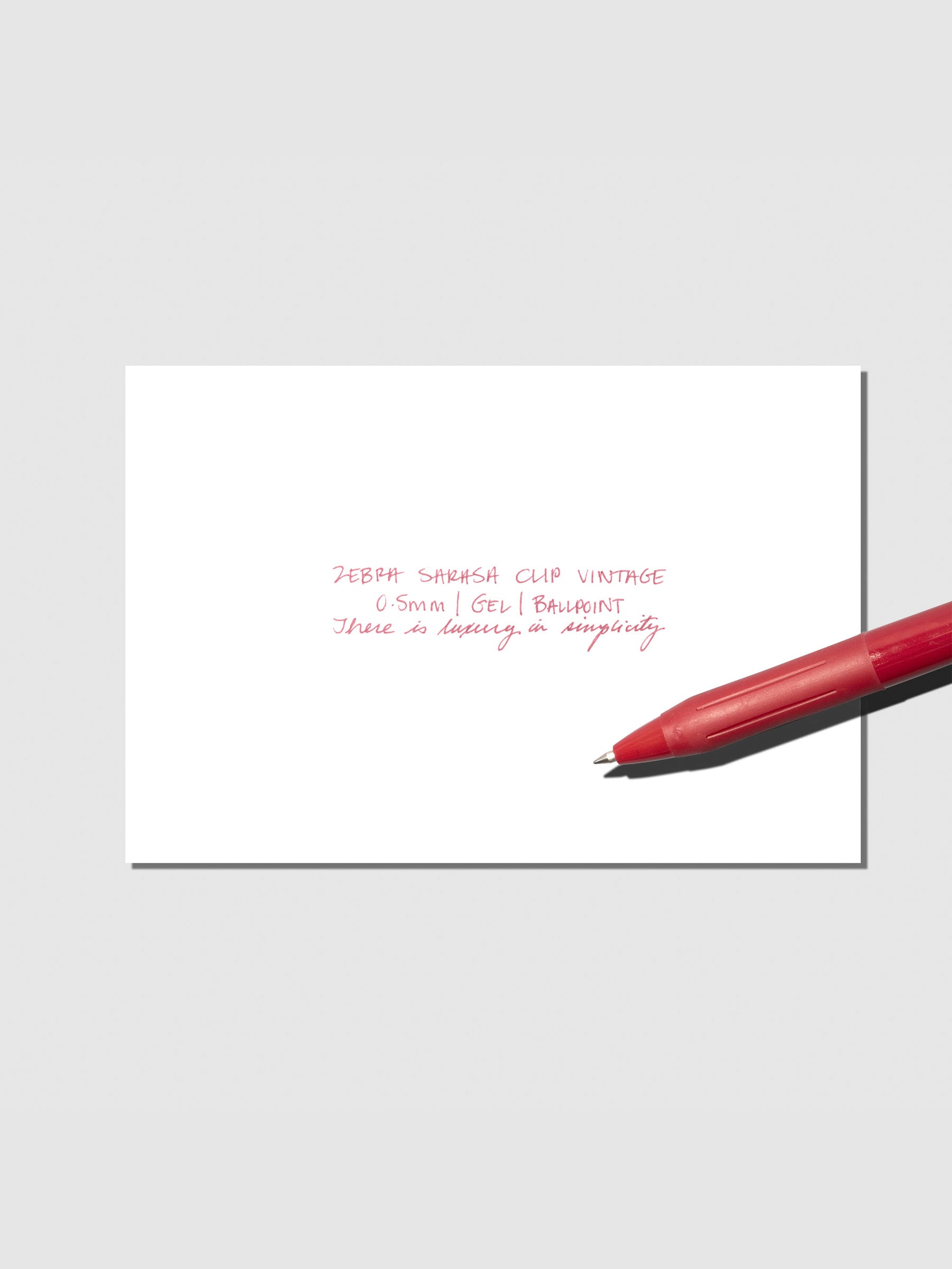 Pen testing sheet displayed with pen on a neutral background. Color shown is Cassis Black.