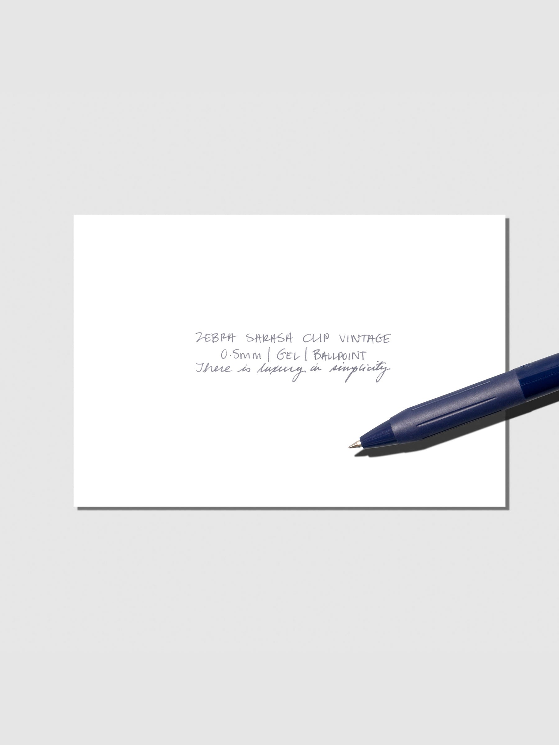 Pen testing sheet displayed with pen on a neutral background. Color shown is Dark Blue.