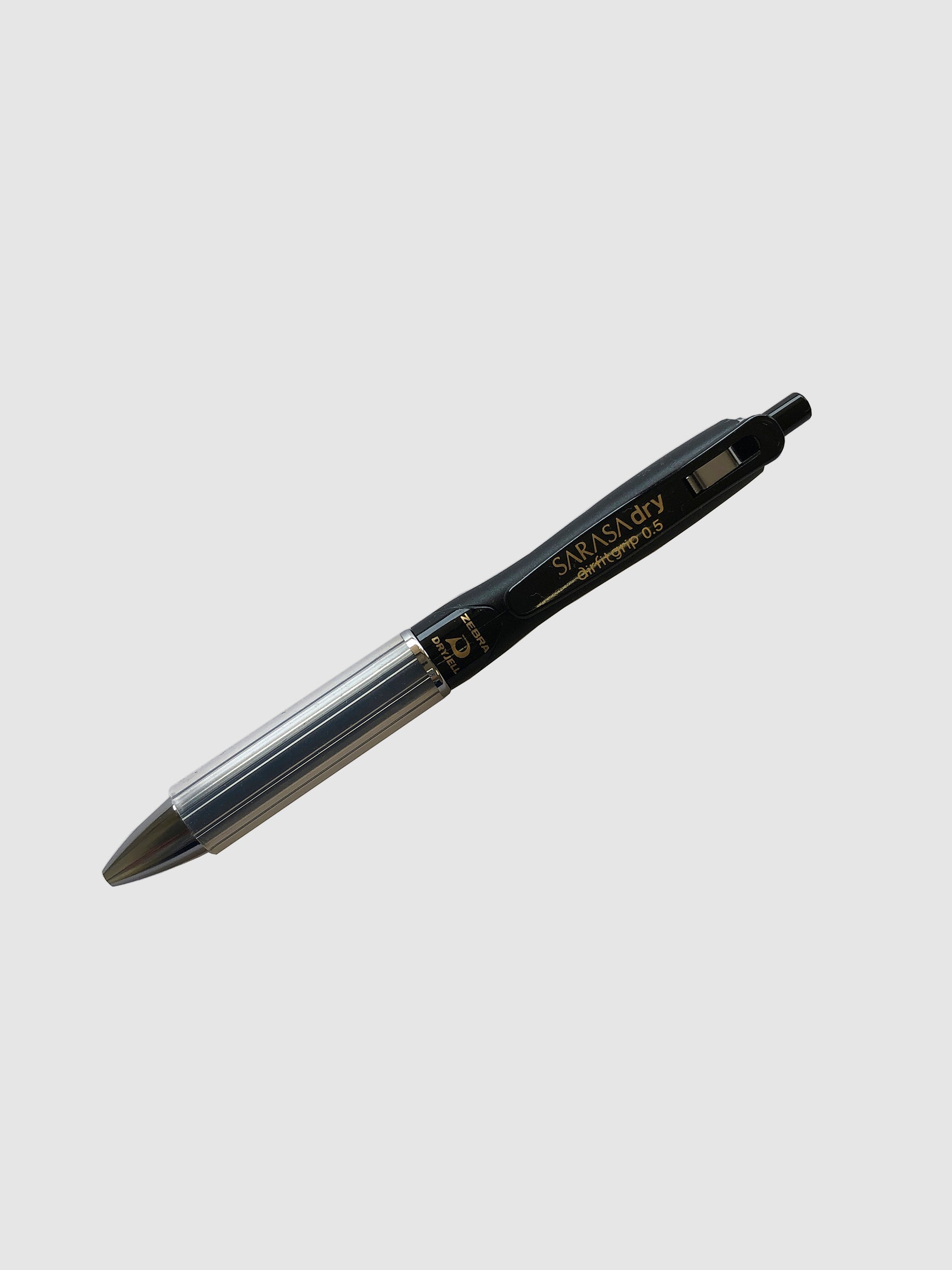 Zebra Sarasa Dry Airfit Grip Rollerball Pen, Black, 0.5mm, Cloth & Paper. Pen turned to the left against a neutral background.